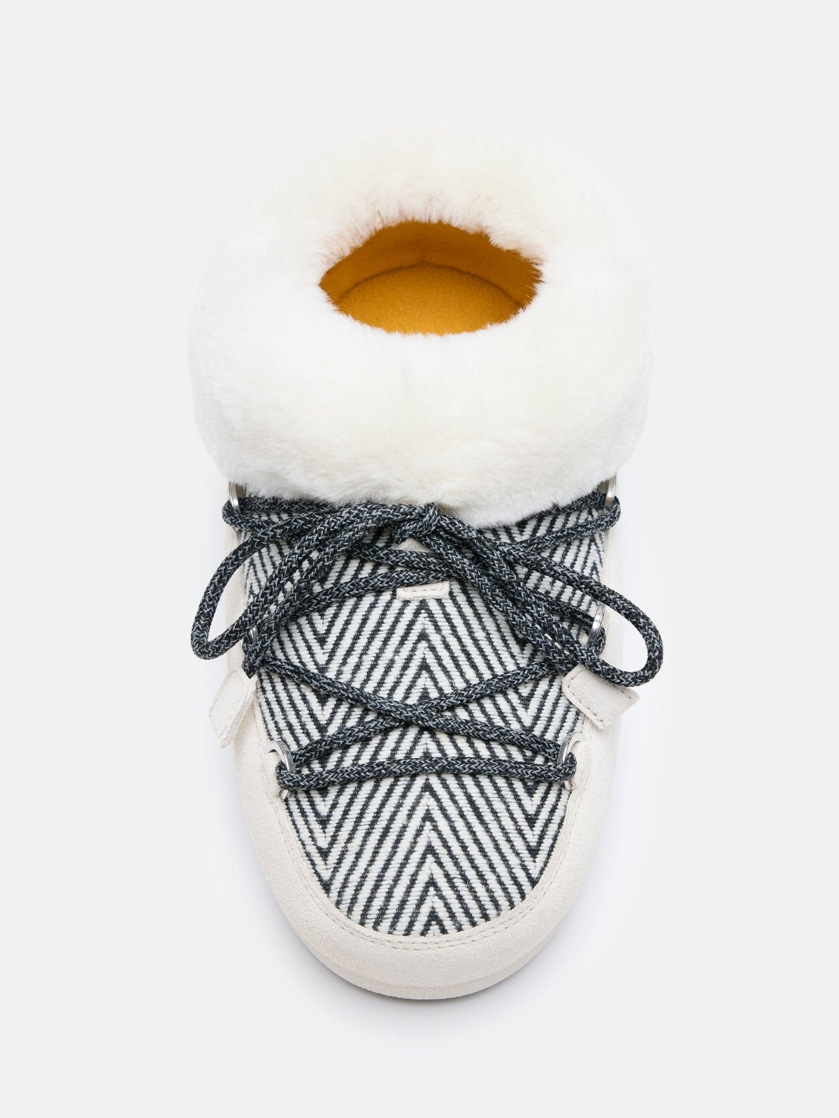 Top view of MB X GIR EVX Chalet Mule Fur with striped pattern, black laces, and white fur collar cushioning