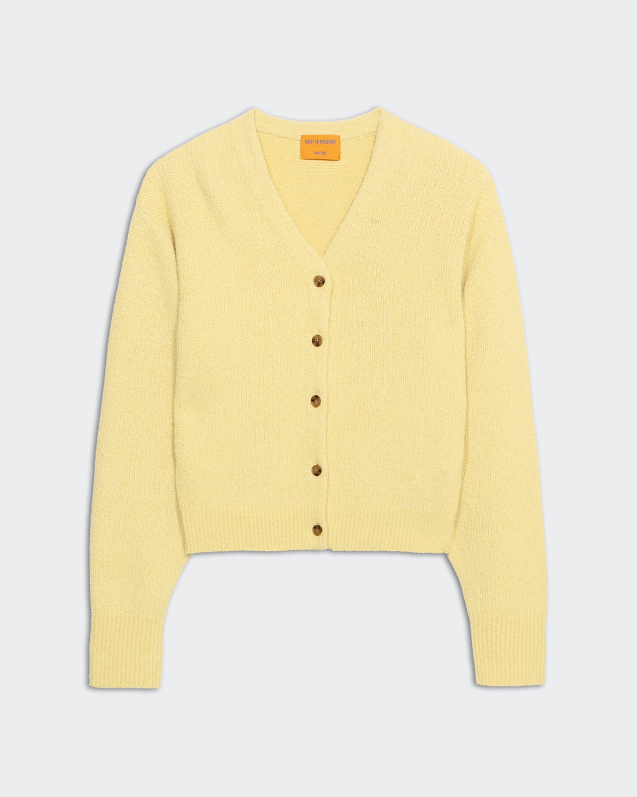 Boucle Collegiate Cardigan Butter in midweight fabric with V neck and button front closure in soft yellow.