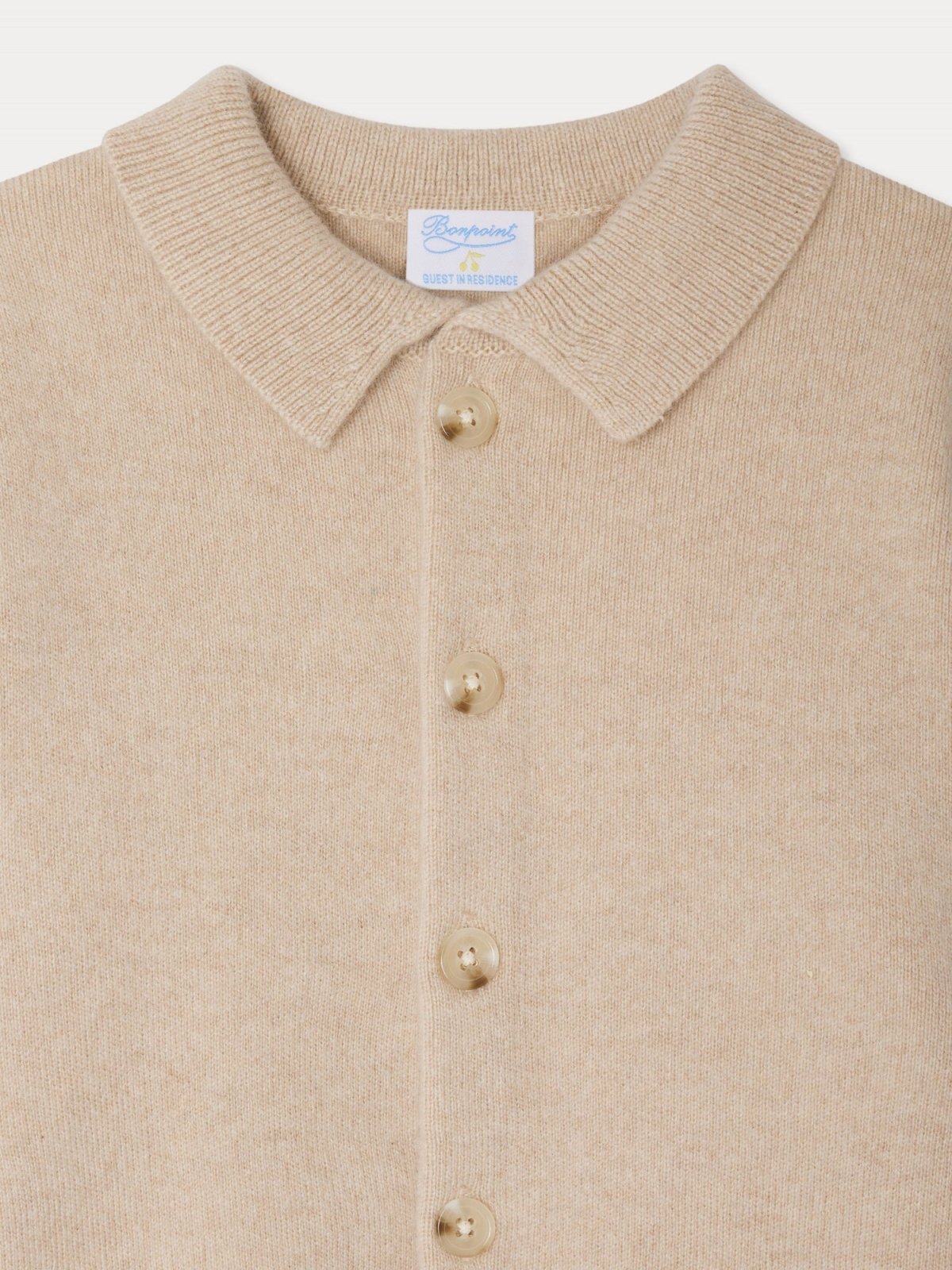 Close-up of beige LIBERTE jacket in 100% cashmere with pointed collar and front button fastening