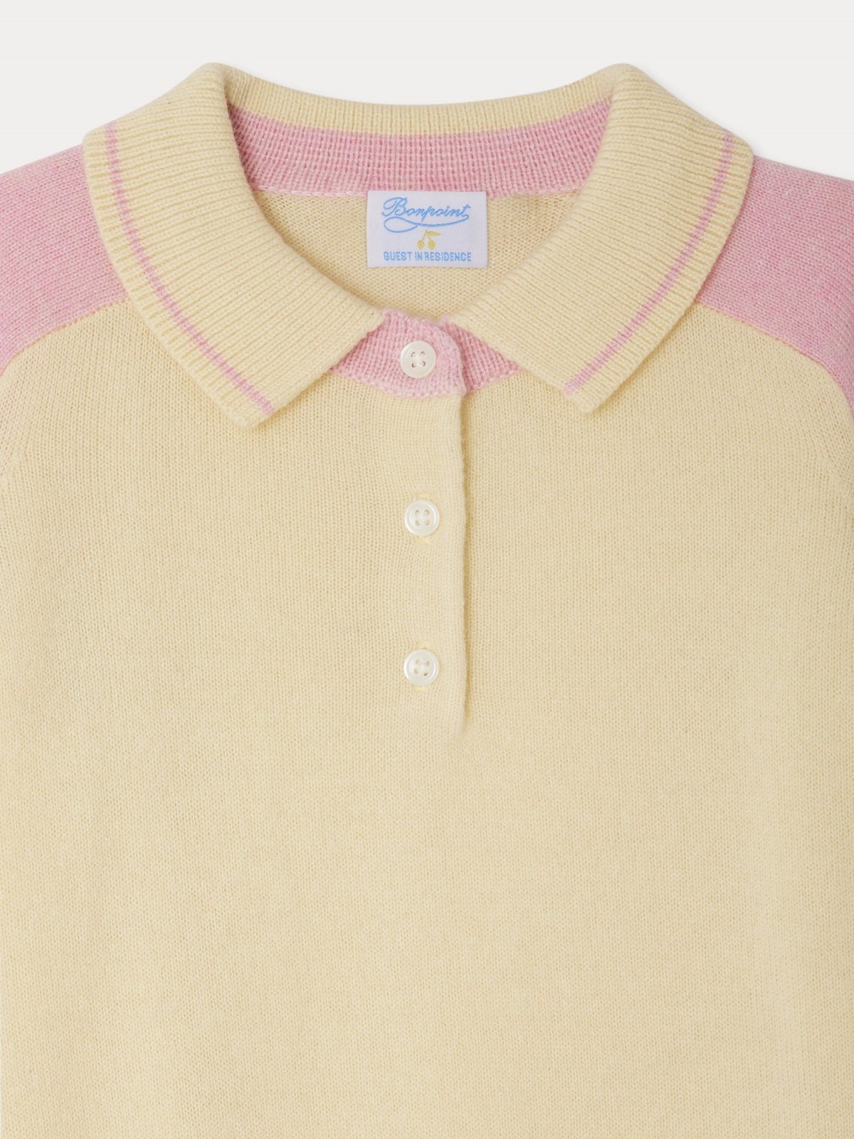 Close-up of Lynsey sweater polo collar with ribbed cuffs in soft pink and cream cashmere fabric