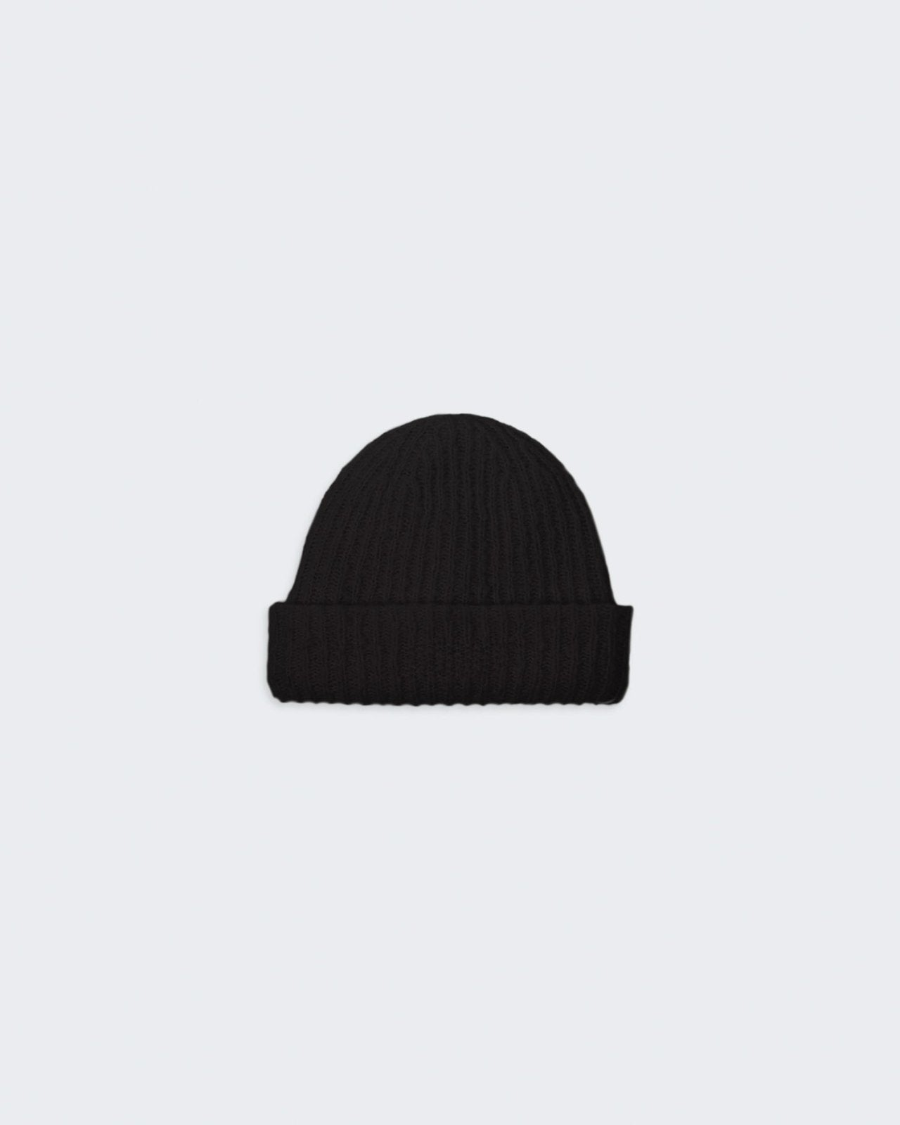 A black, chunky knit beanie with a high cuff hem and the signature GIR branding at the center front trim.