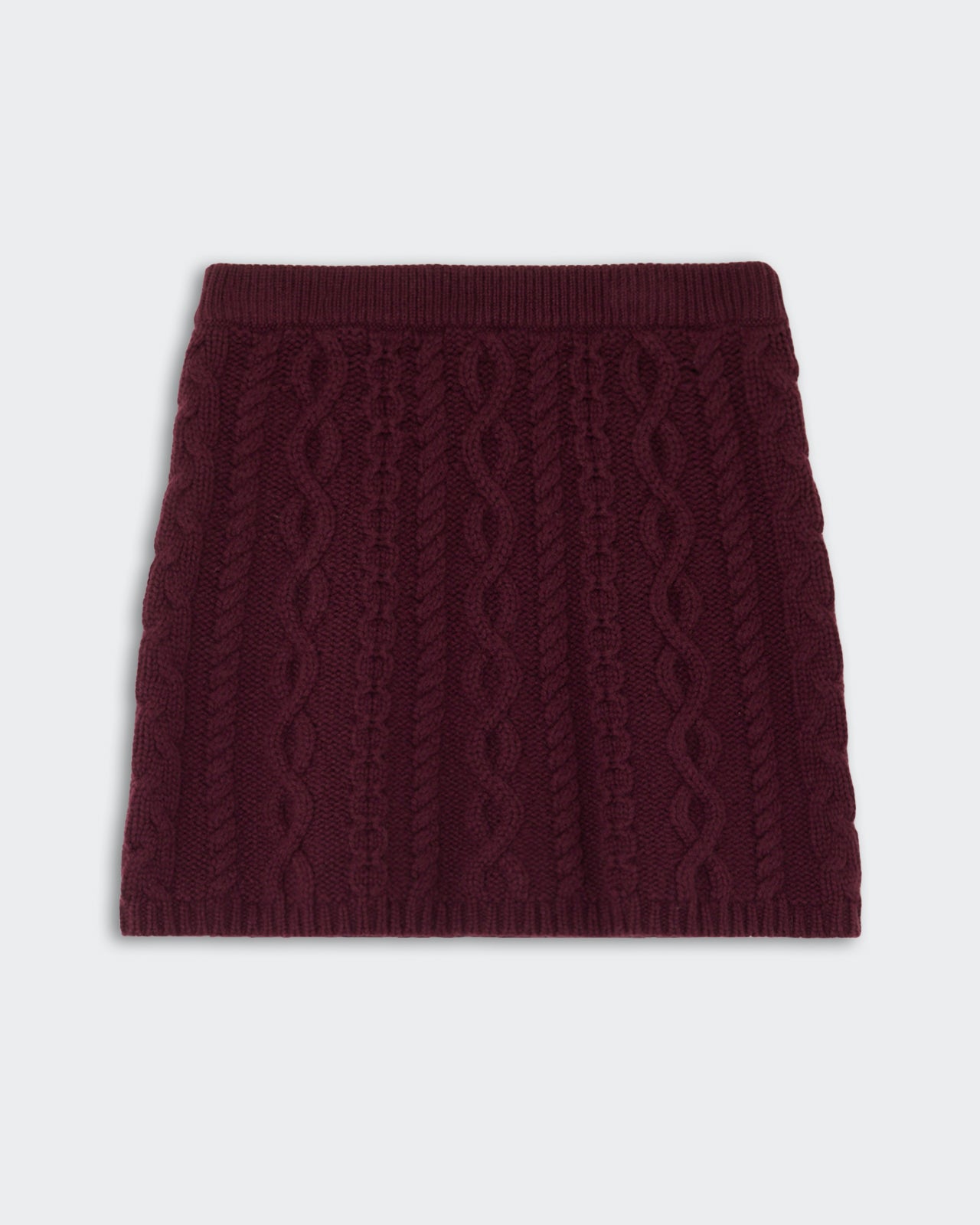 Cable Mini Skirt - Fig in rich fig color featuring a textured cable knit pattern with a ribbed waistband for a cozy and stylish cashmere look.