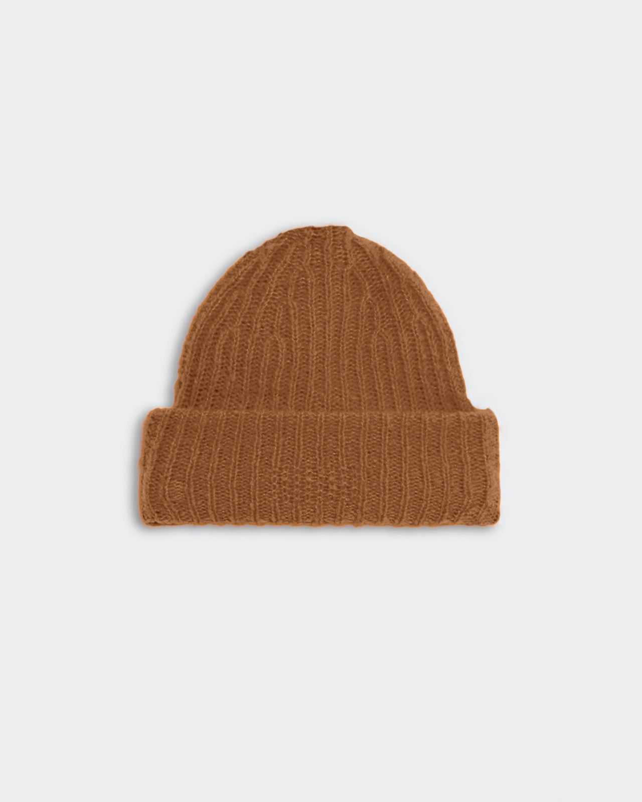 Chunky knit almond-colored rib beanie with high cuff hem made from 90% merino wool and 10% polyamide.