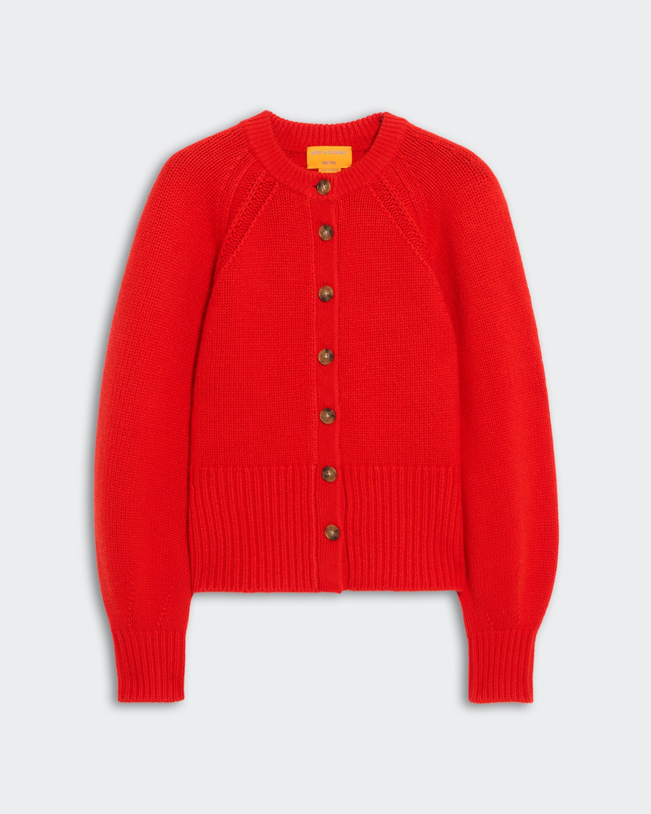 Red women’s cashmere sculpted cardigan with front buttons, puffed raglan sleeves, and ribbed hem and cuffs.