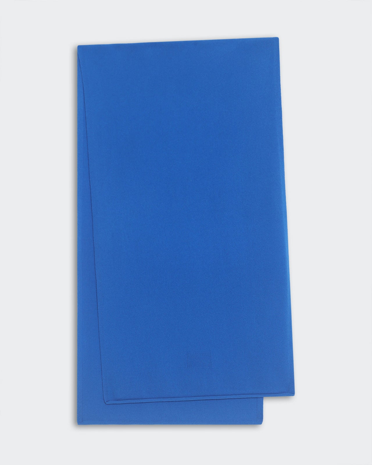Folded lightweight blue cashmere scarf measuring 74 by 19 inches with a jersey roll hem detail.