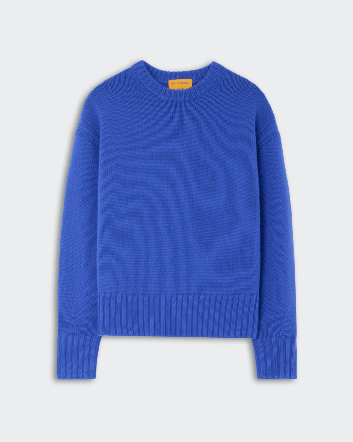 Bright blue cashmere crewneck sweater with ribbed cuffs and hem, displayed flat on a light gray background.