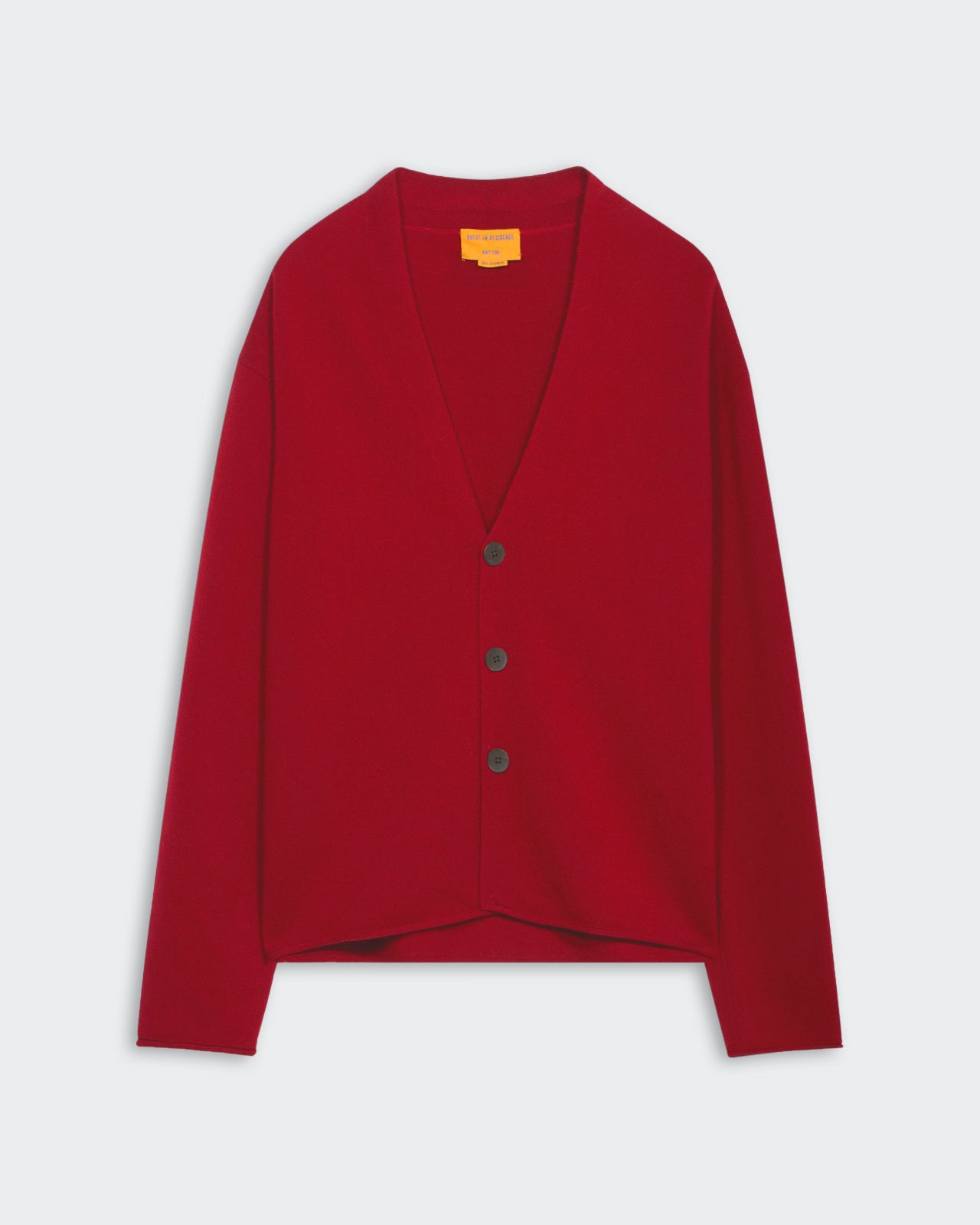 Ruby red medium-weight men's cardigan with three buttons, shawl collar, roll hem, and signature GIR branding