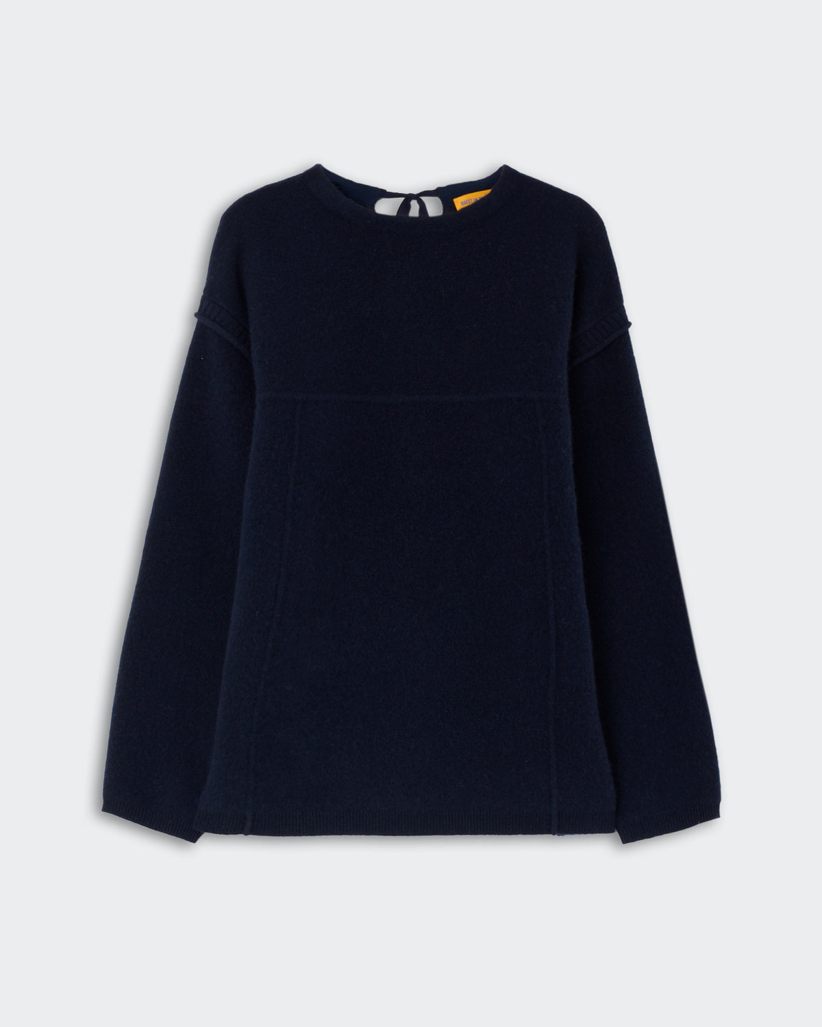 Long-sleeve navy blue sweater with a crew neckline and subtle seam detailing across the chest and sleeves, displayed on a light gray background.