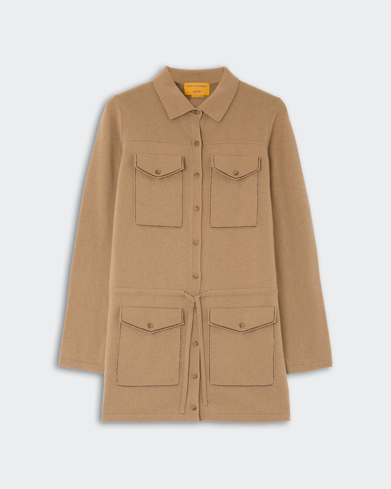 Industry Mini Dress - Camel in a soft camel color featuring a button-down front, four flap pockets with buttons, and a waist tie for a tailored silhouette.