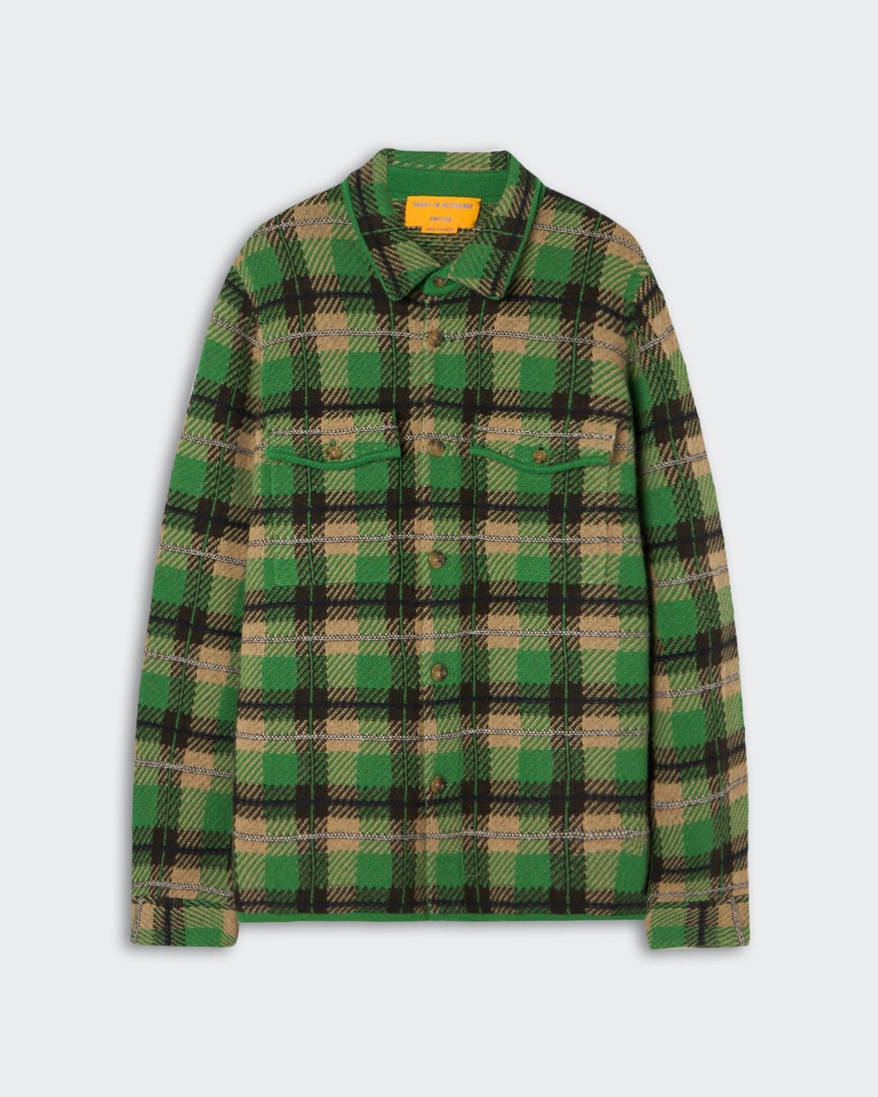 Green and beige plaid long-sleeve button-up shirt with two chest pockets and a collar, laid flat on a white background.