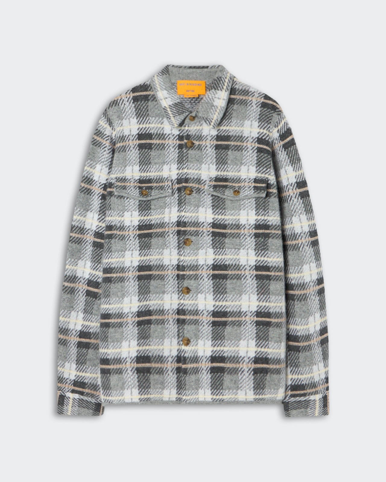 Gray, white, and black plaid button-up shirt with long sleeves and chest pockets, displayed on a light gray background.