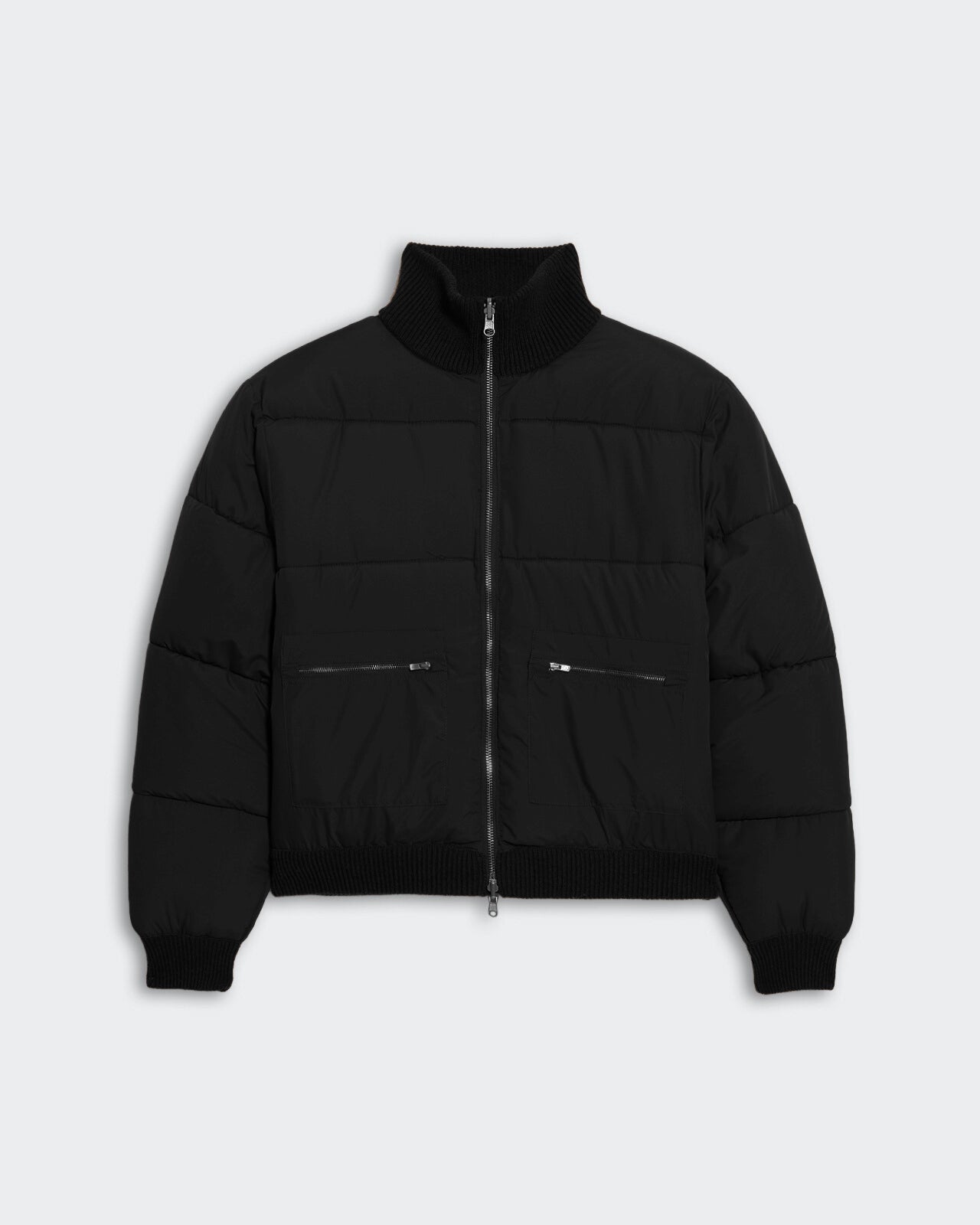 Black quilted puffer jacket with square grid stitching, ribbed collar and hems, and front zip pockets.