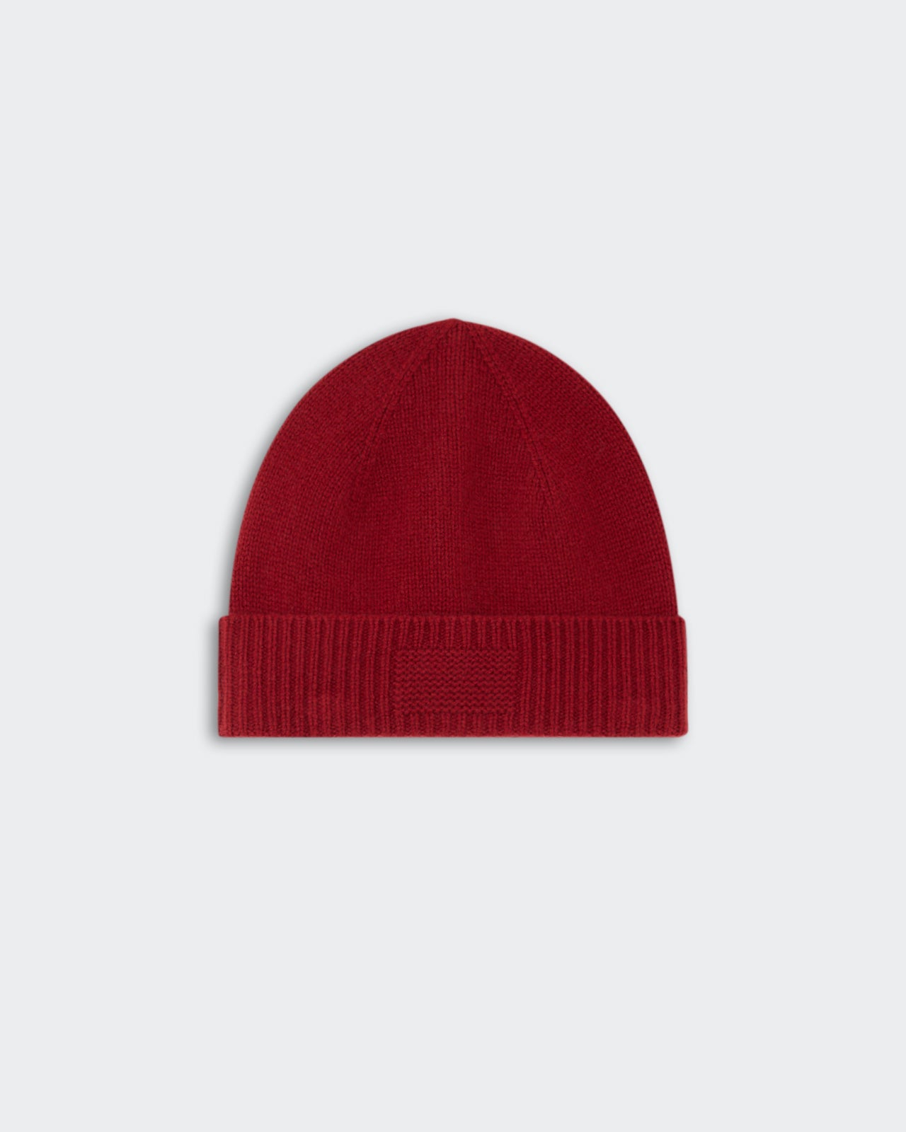 Rib Cuff Beanie - Carmine in a rich red color, featuring a ribbed cuff design for a snug and stylish fit.