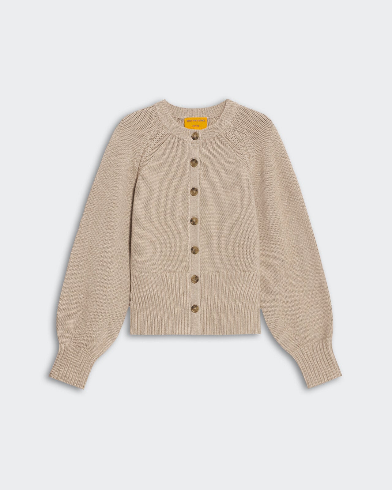 Taupe women’s cashmere sculpted cardigan with puffed raglan sleeves, front buttons, and ribbed hem and cuffs.
