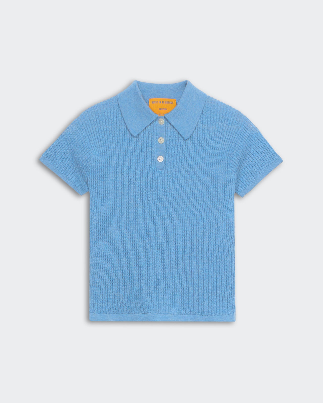 Shrunken Polo - Denim Blue women's waffle knit cashmere polo shirt with three-button front placket and short sleeves.
