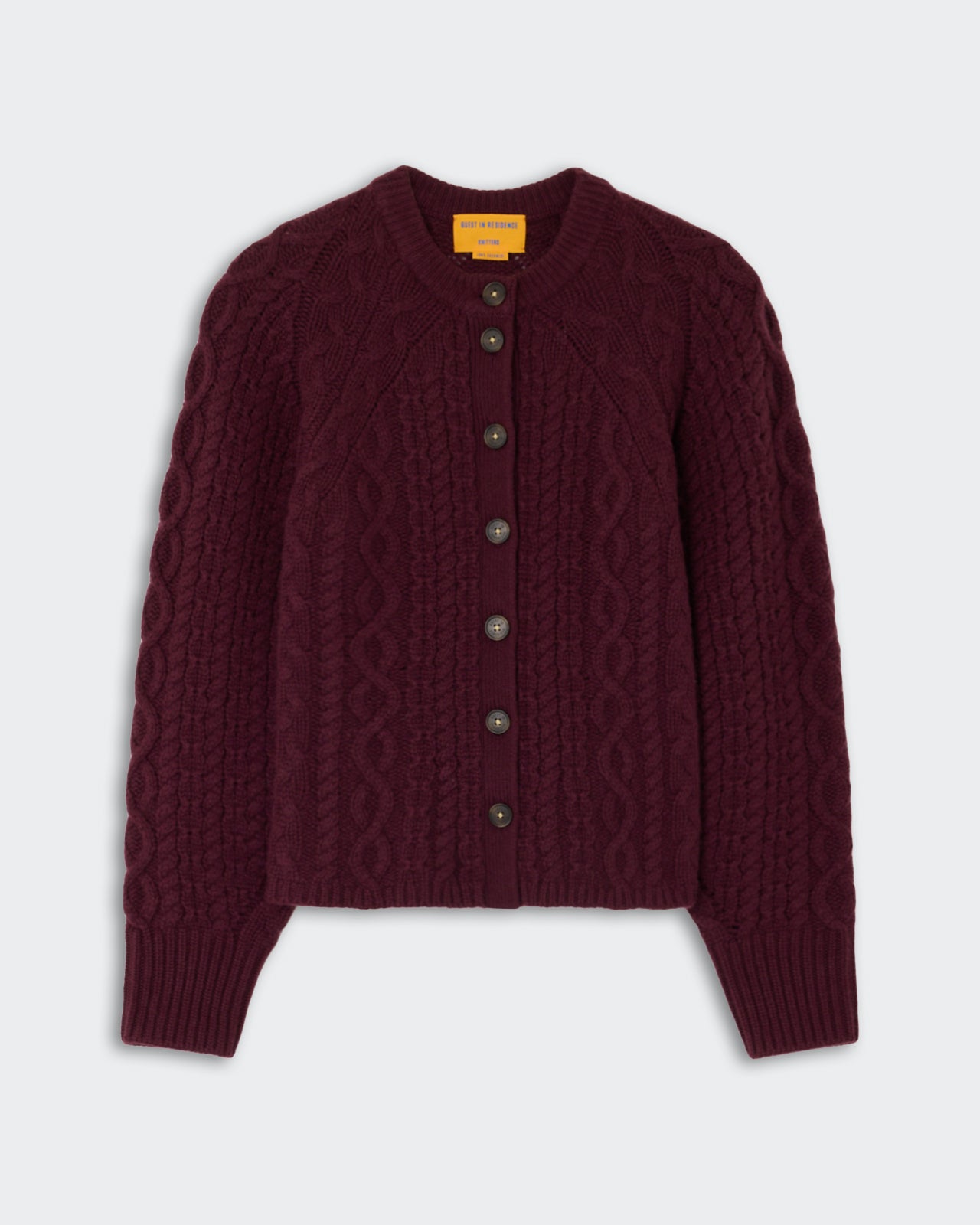 Cable Sculpted Cardigan - Fig in deep purple with intricate cable knit design, long sleeves, ribbed cuffs, and button-down front made from soft cashmere fabric.