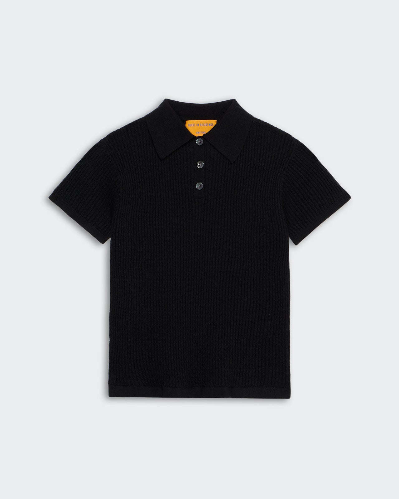 Shrunken Polo - Black women's short sleeve waffle knit cashmere polo shirt with three-button placket and collar.