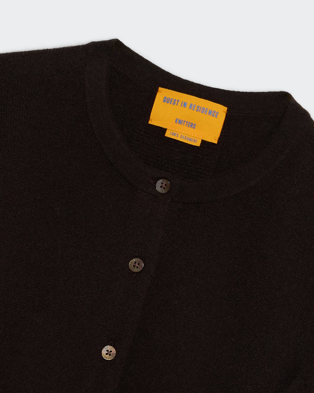 Jane Cardigan - Burnt Cocoa close-up of buttoned collar and textured knit fabric on light background