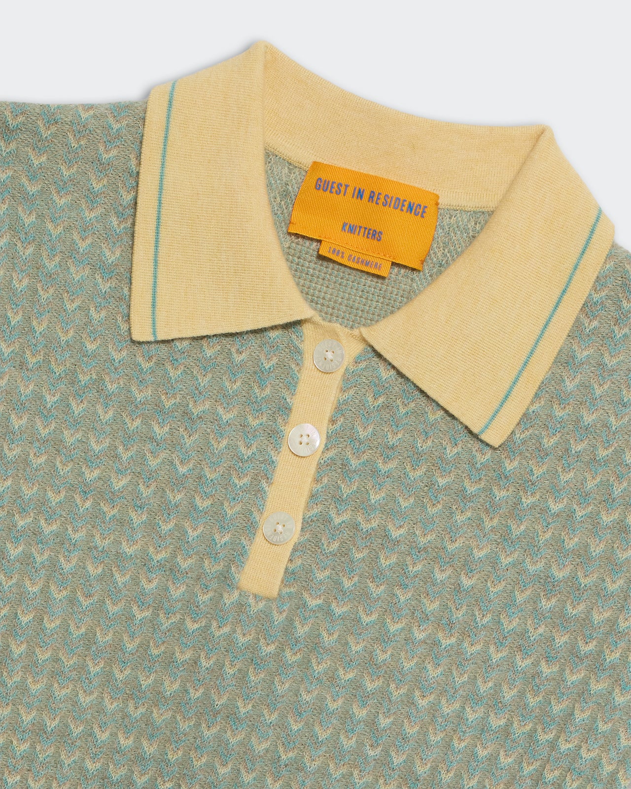 Chevron Shrunken Polo Butter Combo with yellow collar and blue chevron knit pattern close-up view