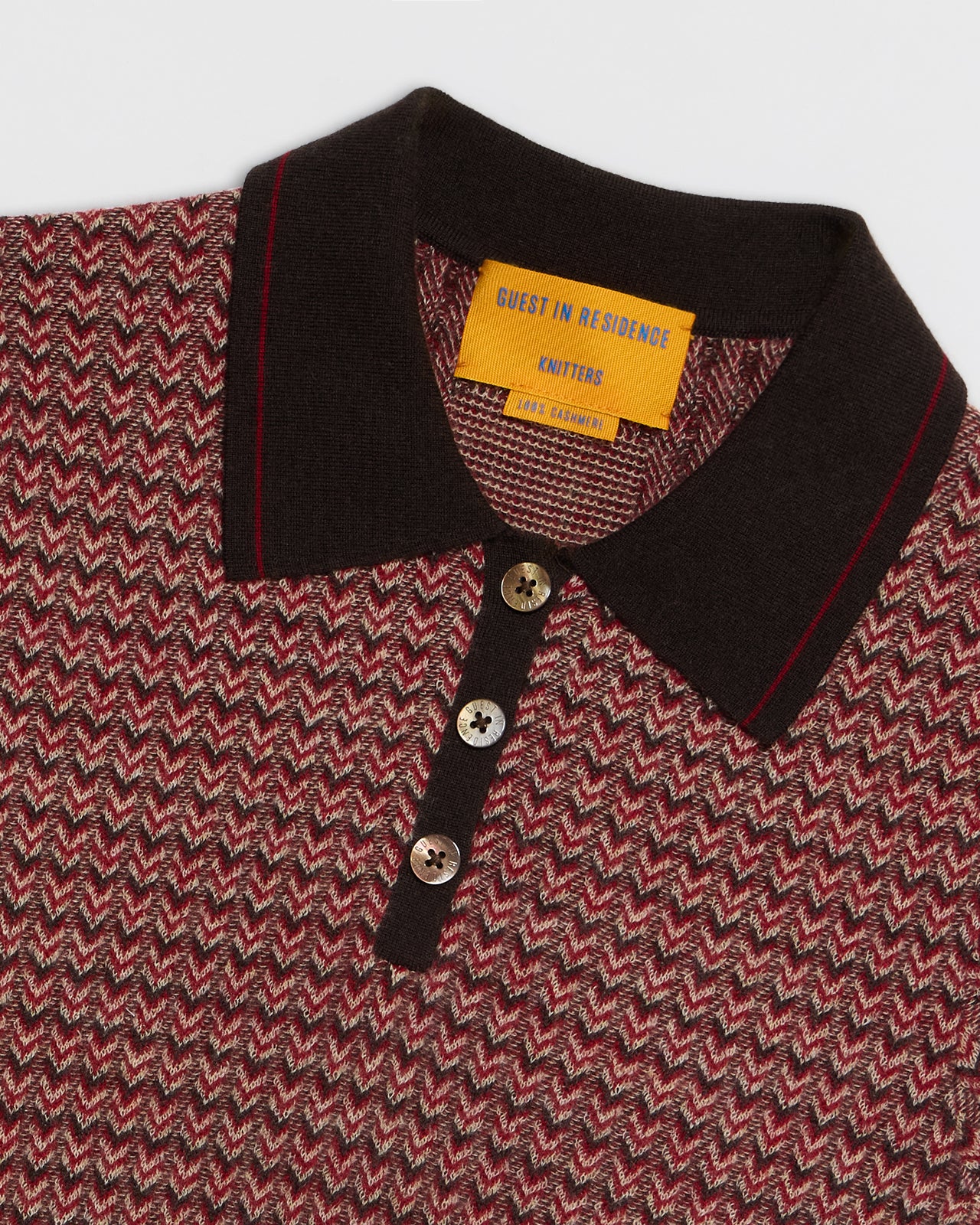 Chevron Shrunken Polo - Burnt Cocoa Combo featuring a chevron pattern with a dark collar and button placket detail.