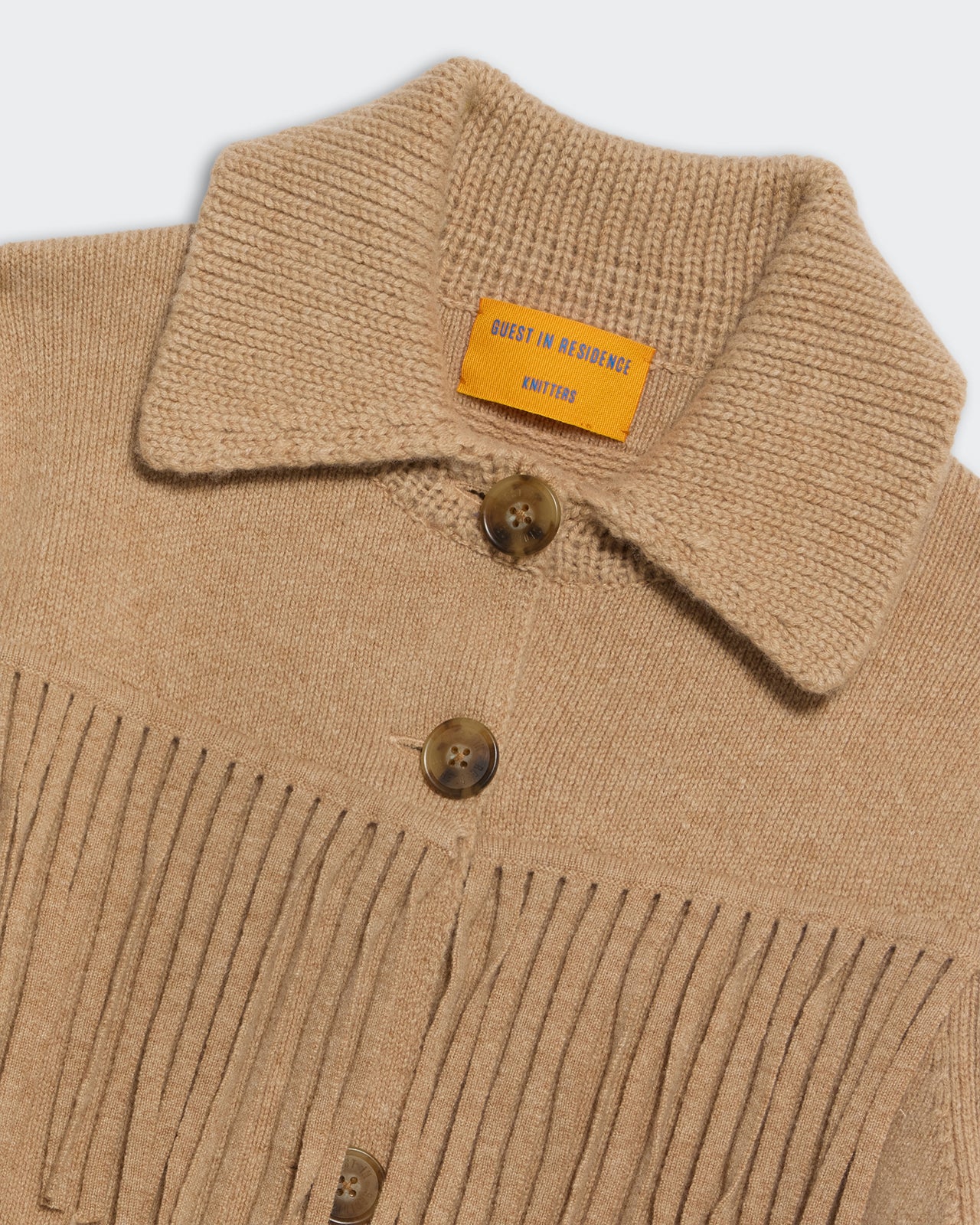 Western Fringe Jacket - Dune close-up of knit collar, button closure, and fringe detail on a cashmere blend jacket.