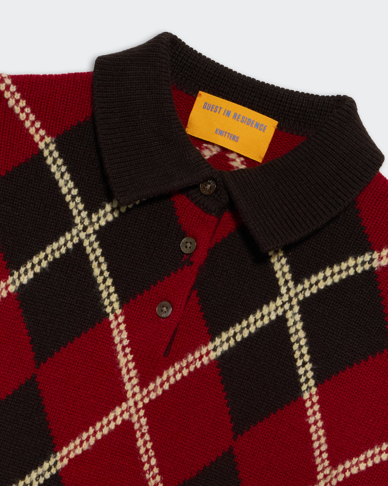 Collegiate Argyle Polo Burnt Cocoa Combo featuring a red, brown, and cream classic argyle knit pattern with button collar