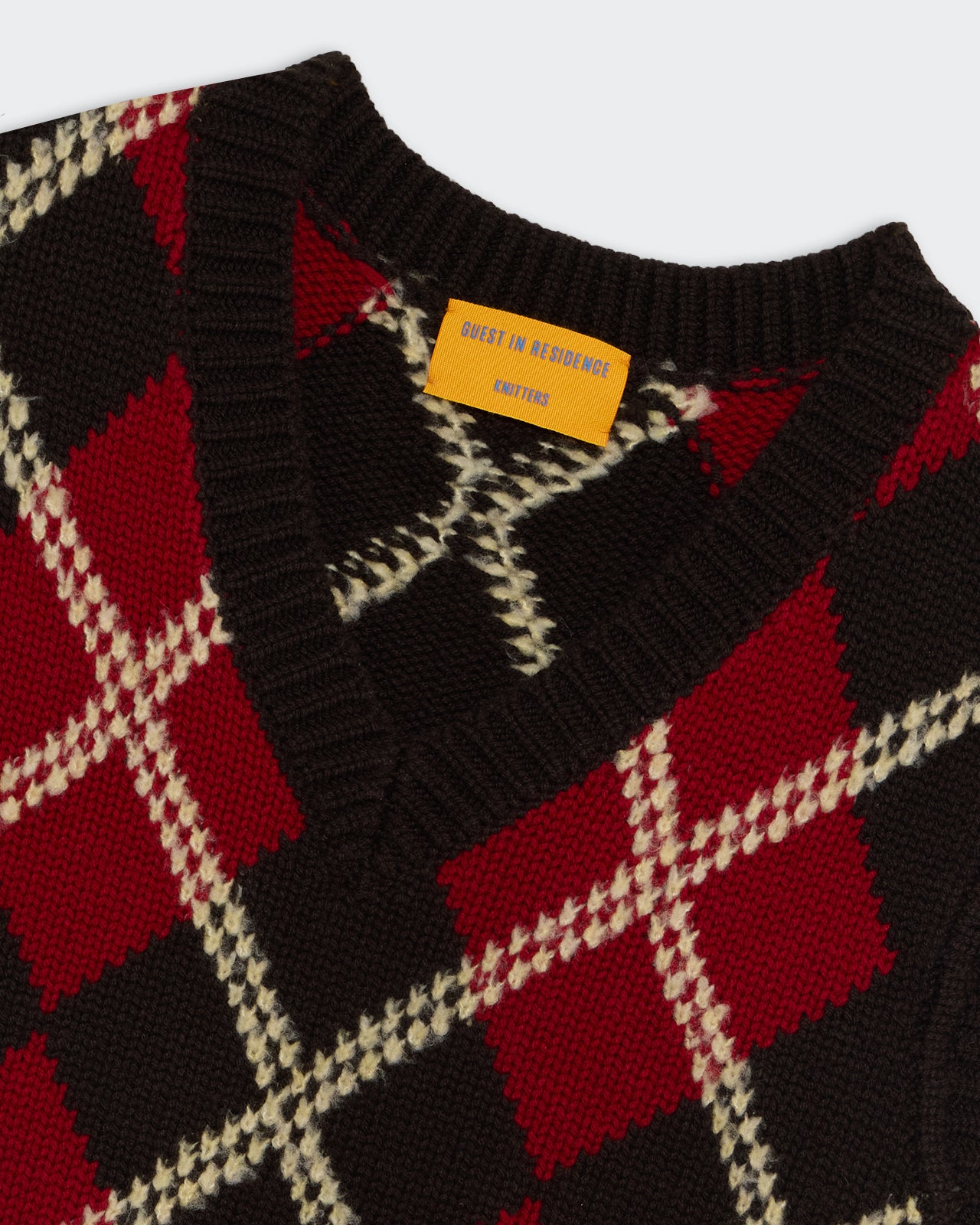 Argyle Vest - Burnt Cocoa Combo featuring a deep V-neck with red, brown, and cream classic argyle knit pattern.