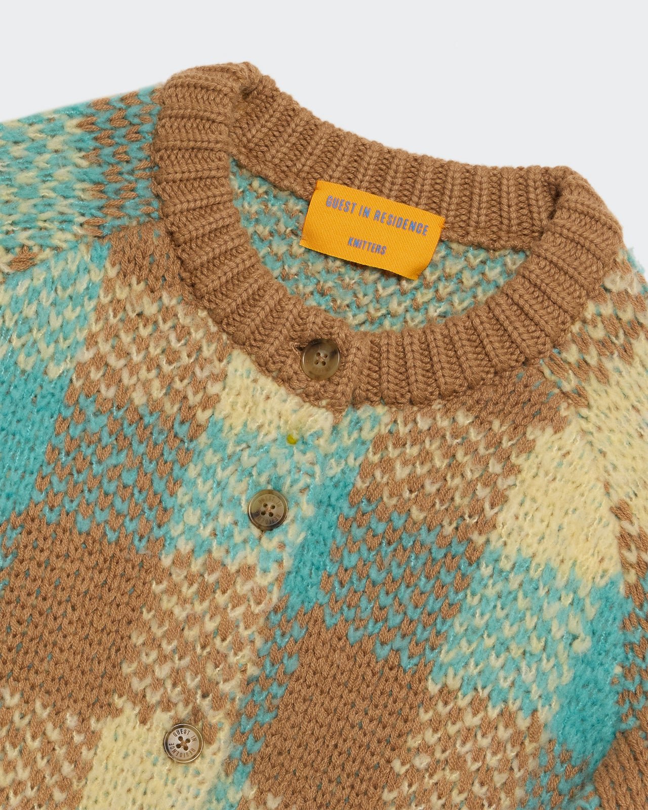 Close-up of the Buffalo Plaid Cardigan - Glacier Combo showing knit texture, buttons, and color pattern in brown and blue tones