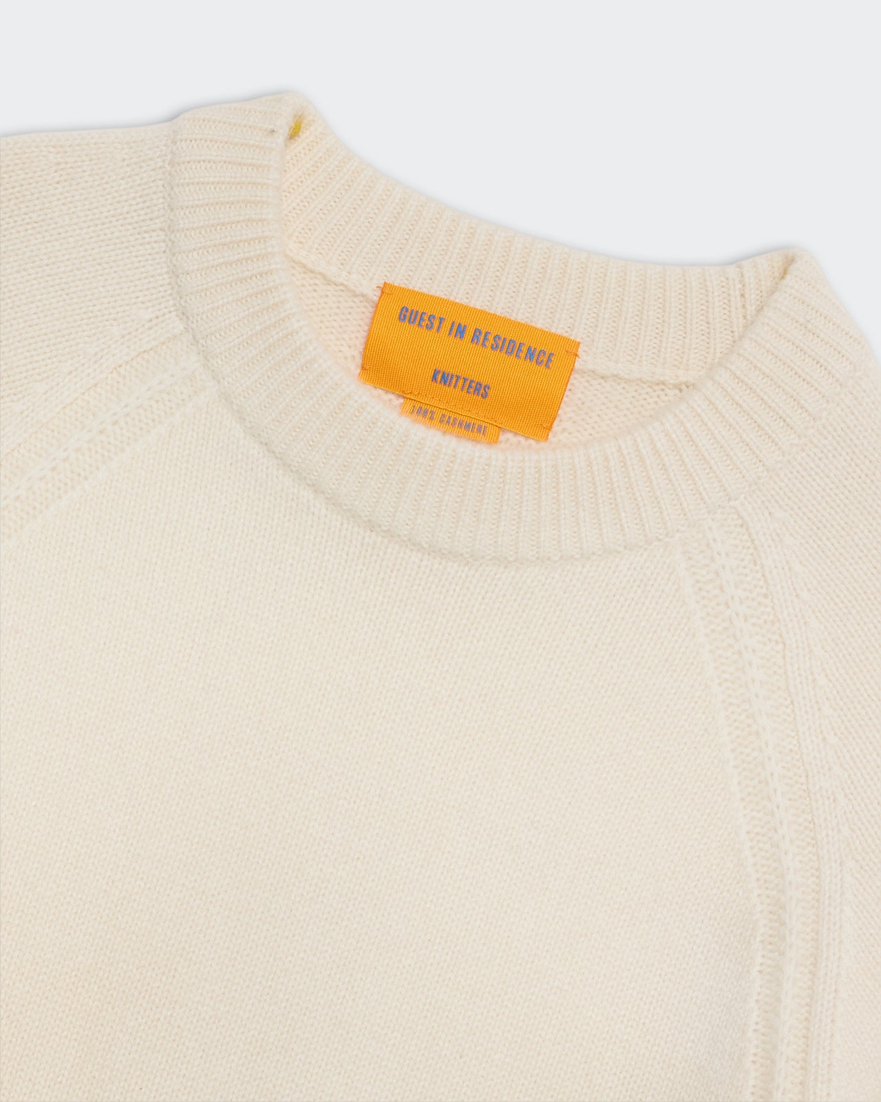 Sculpted Crew - Cream women’s heavyweight cropped cashmere sweater with ribbed crew neckline and raglan sleeves.