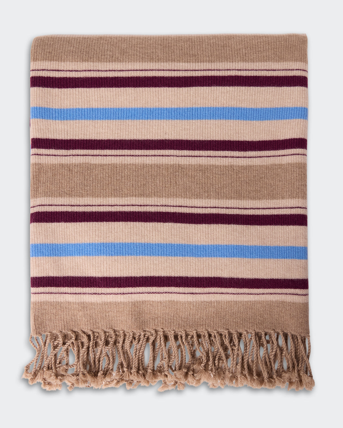 Folded Striped Blanket - Sandstone Combo with horizontal beige, blue, and burgundy stripes and fringed edges, showcasing a soft and cozy texture.