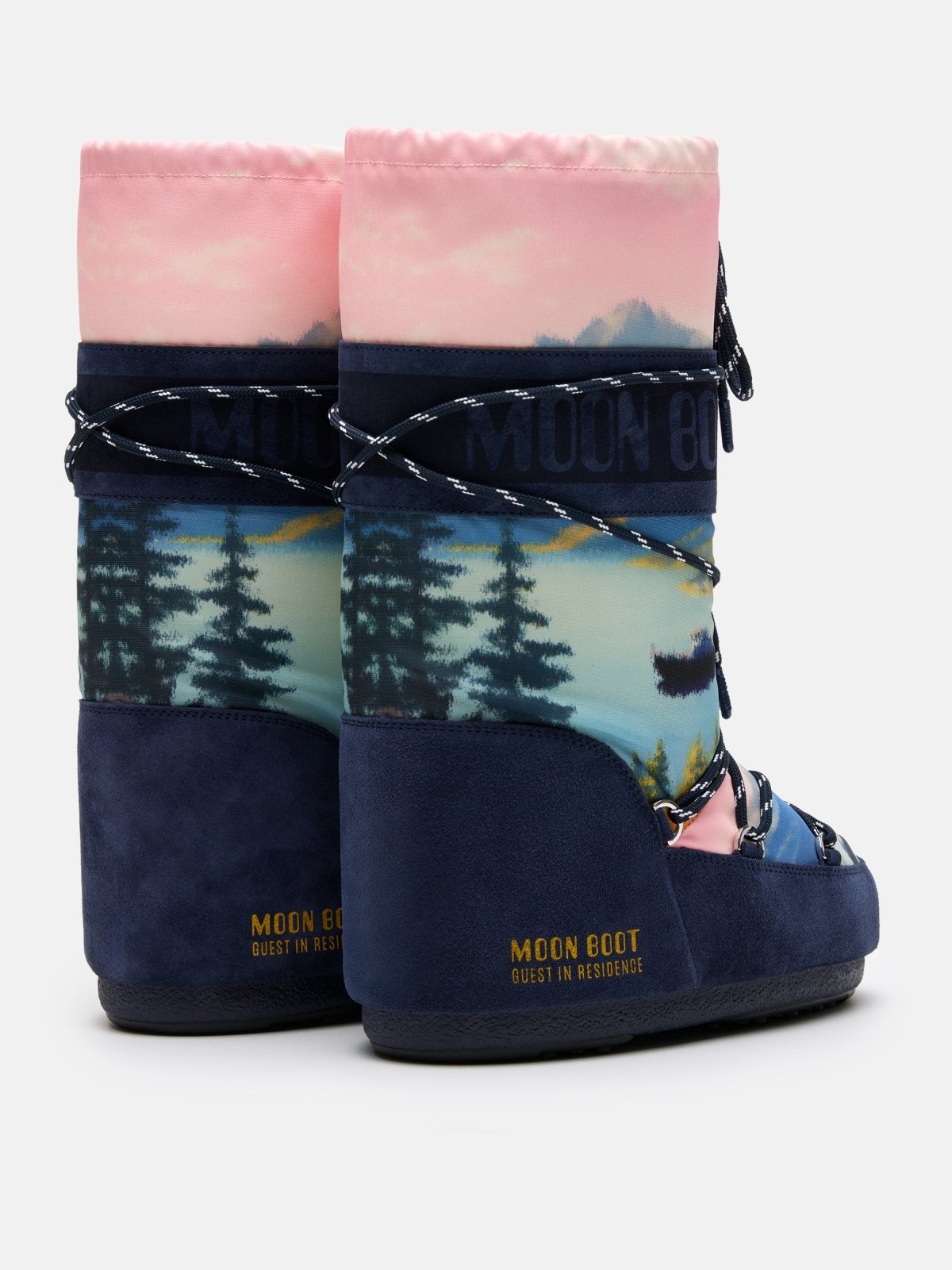 Pair of Moon Boot ICON HIGH POSTCARD winter boots with pink, blue, and scenic nature print design.