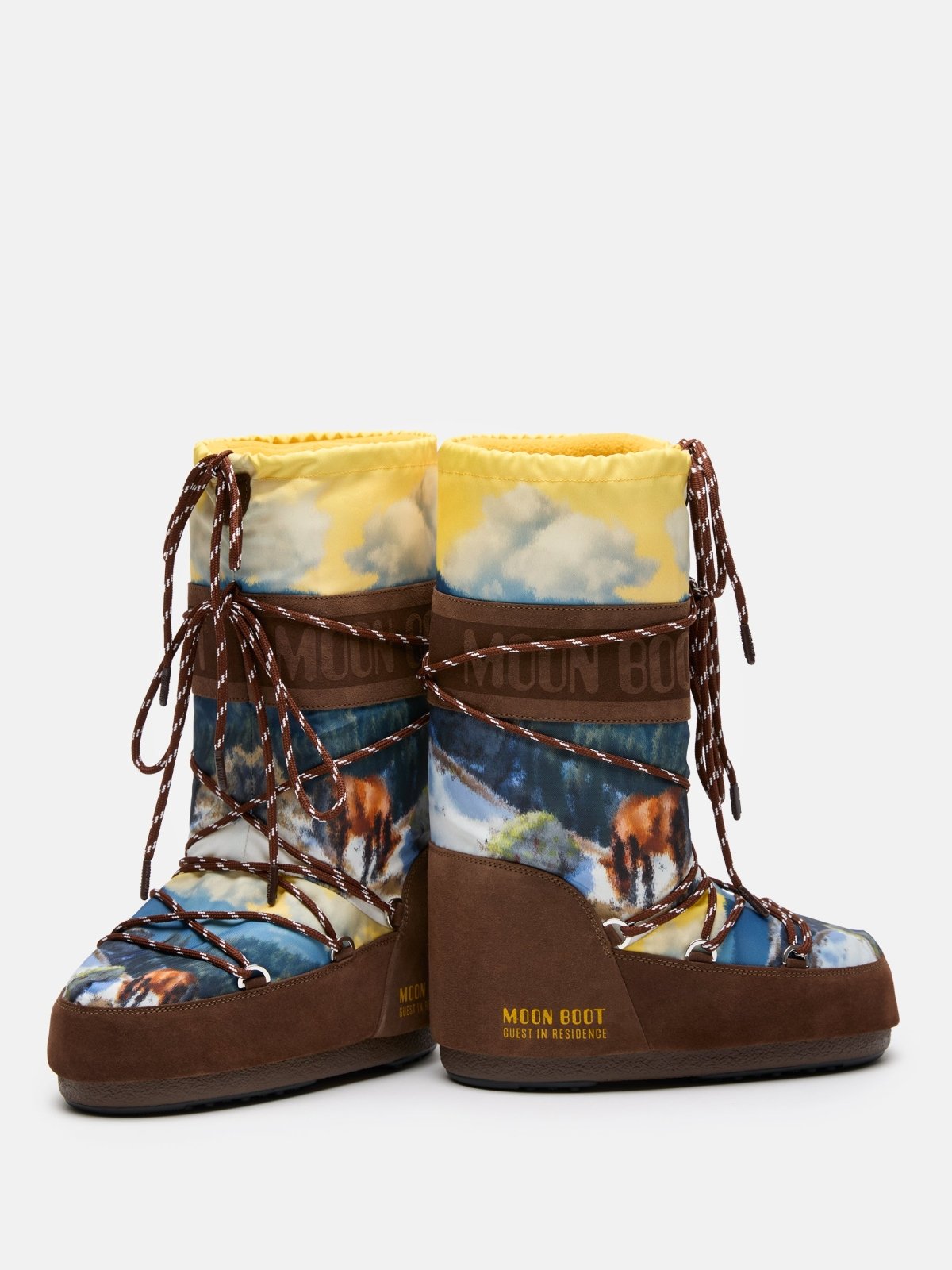 Brown and yellow MB X GIR ICON HIGH POSTCARD winter boots with landscape print and laces on gray background