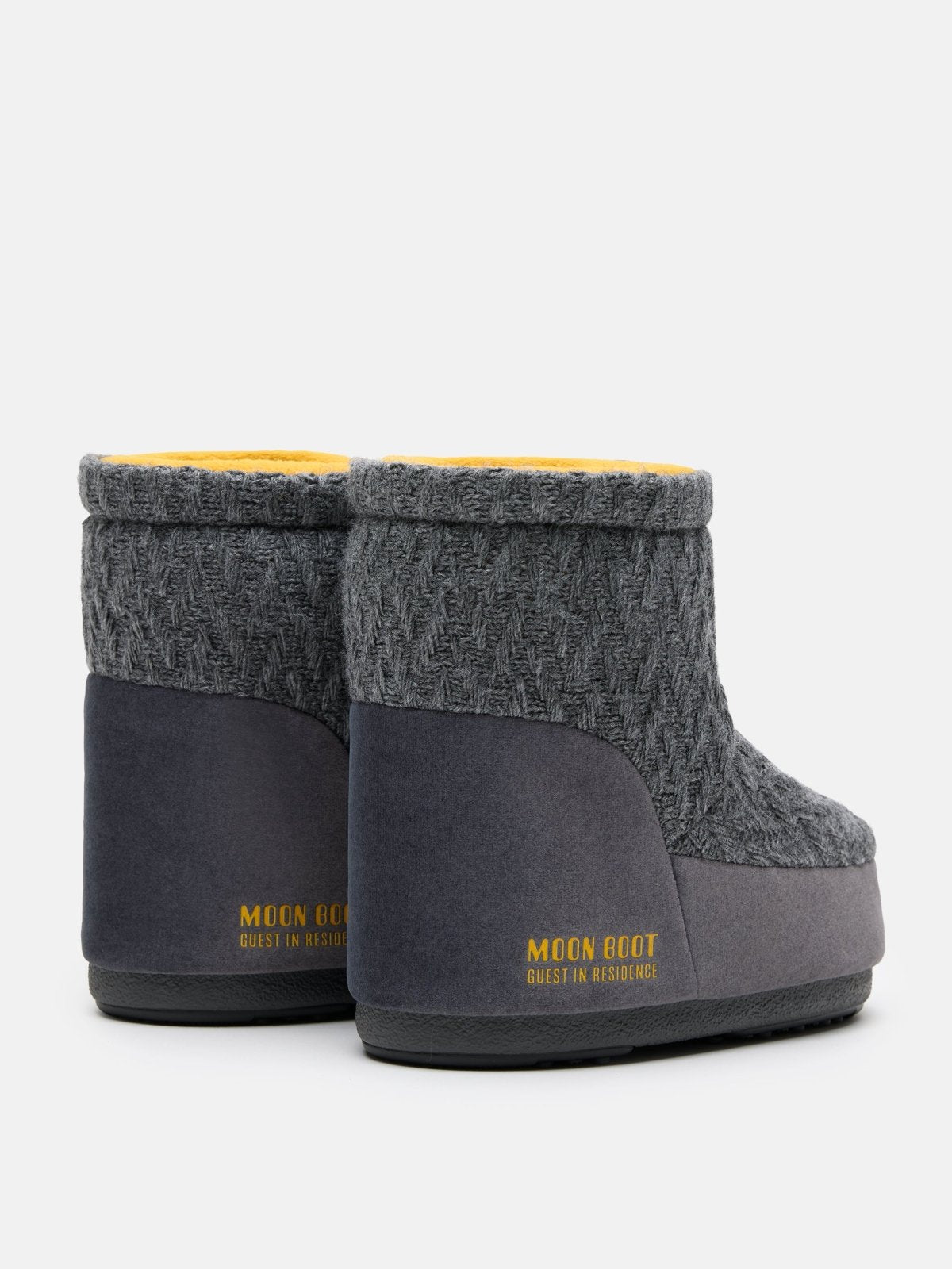 Gray knit MB X GIR ICON LOW NOLACE KNIT ankle boots with yellow lining and rubber sole viewed from the back