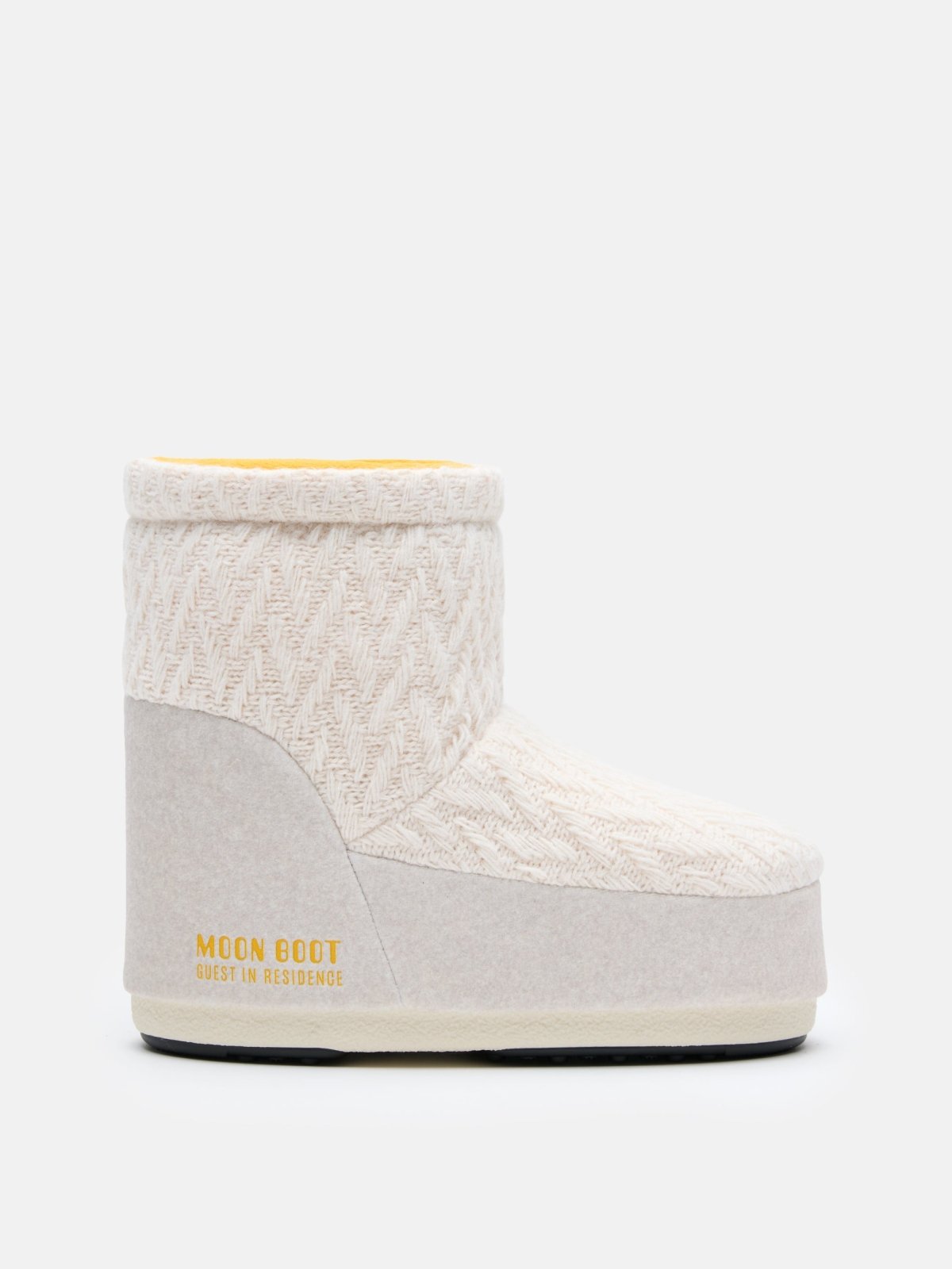 Side view of beige MB X GIR ICON LOW NOLACE KNIT Moon Boot with knitted upper and yellow lining interior