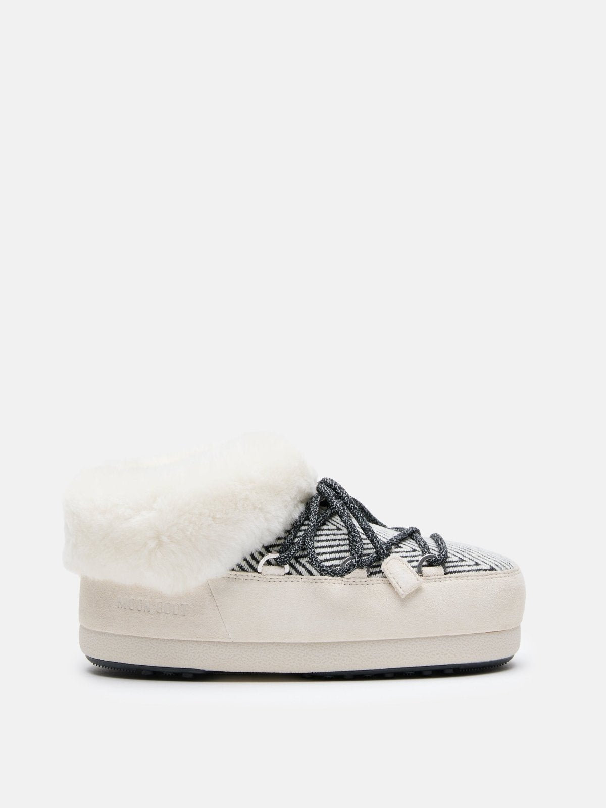 Side view of MB X GIR EVX CHALET MULE FUR cozy winter mule with fur lining and patterned upper on white background