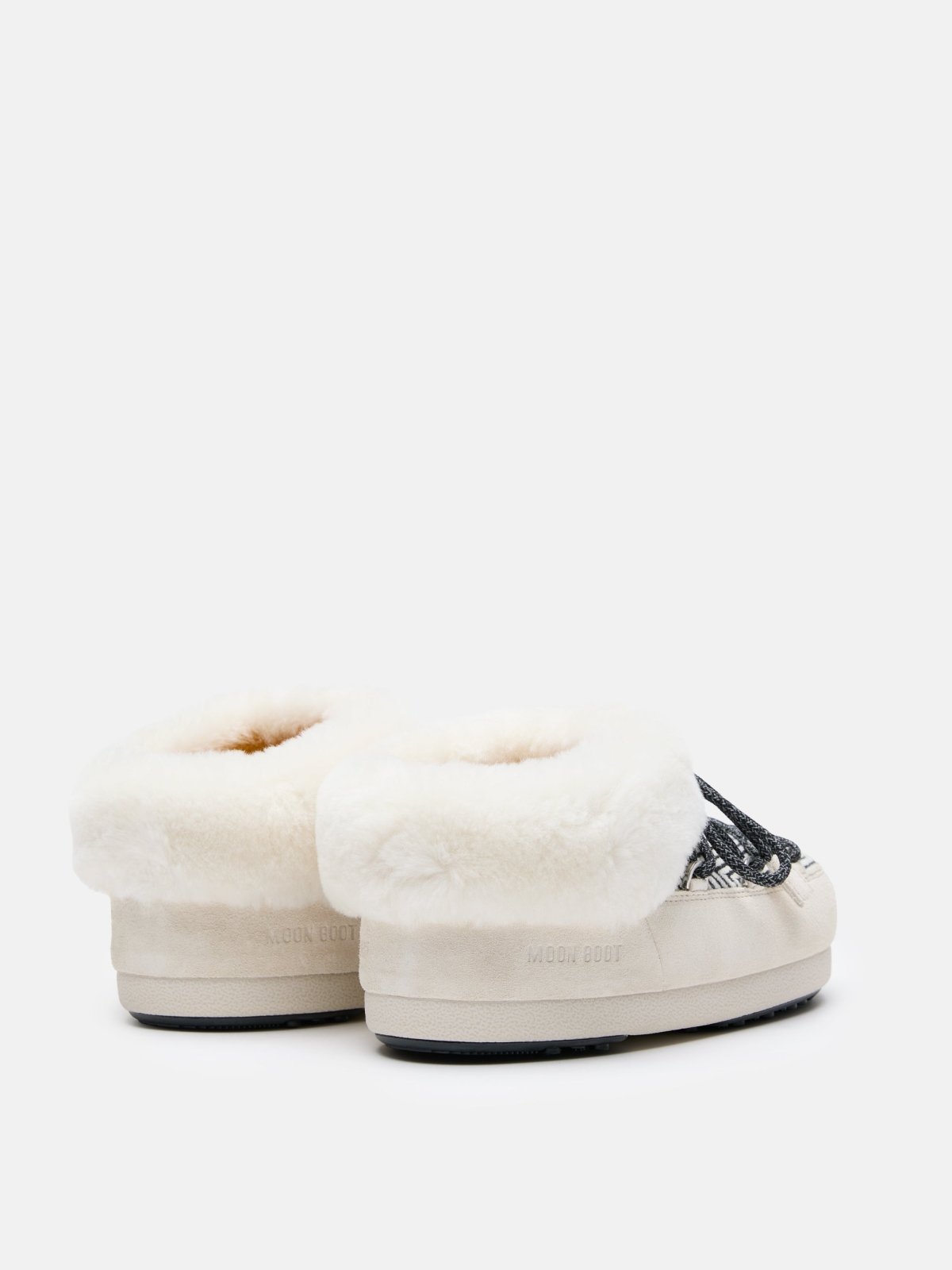 Pair of MB X GIR EVX Chalet Mule Fur slippers with cream fur lining and suede sole viewed from back angle