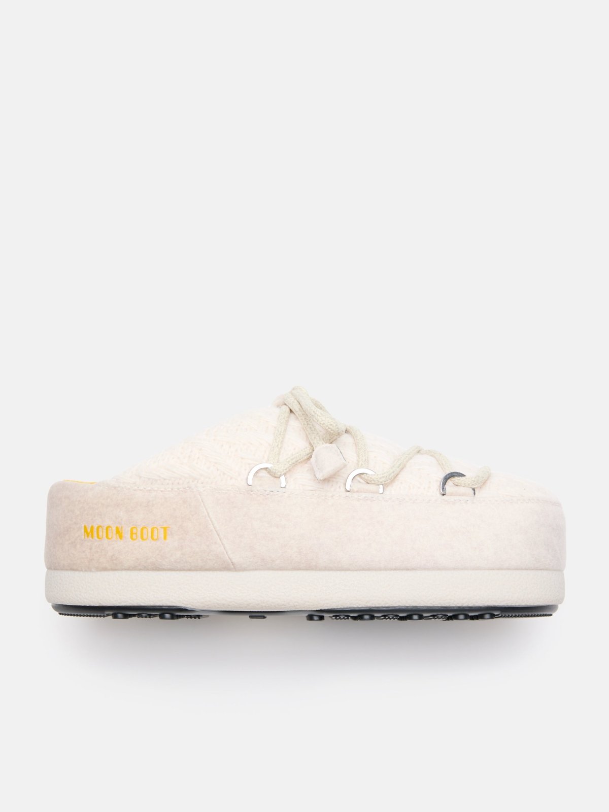 Side view of a cream MB X GIR EVX Mule Knit slipper with thick sole and yellow Moon Boot logo