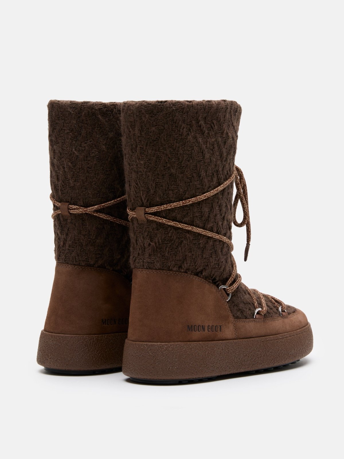 Brown MB X GIR LTRACK KNIT winter boots with knit upper and lace-up design on white background