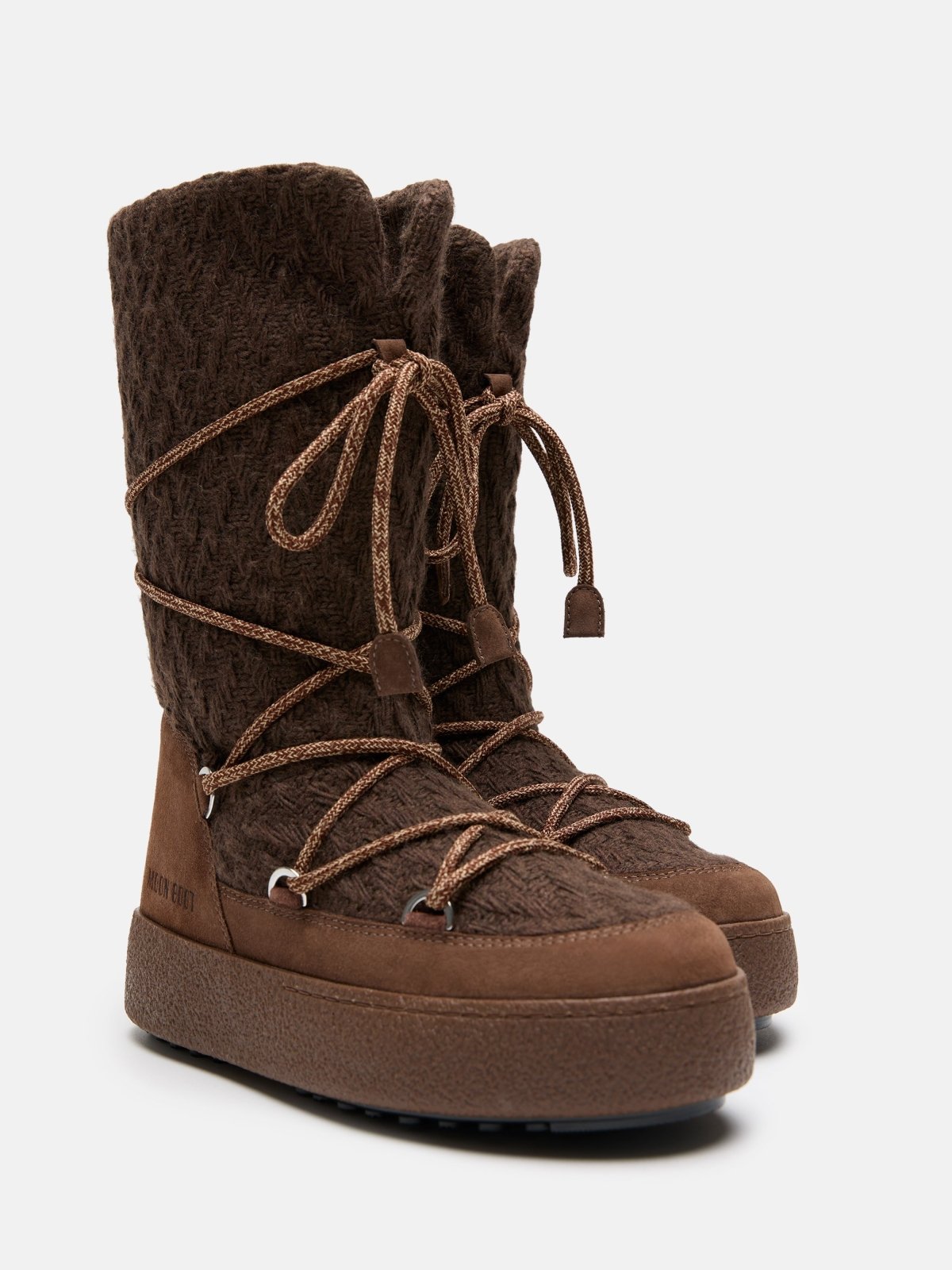 Brown knit winter boots with thick soles and lace-up design for warm outdoor wear