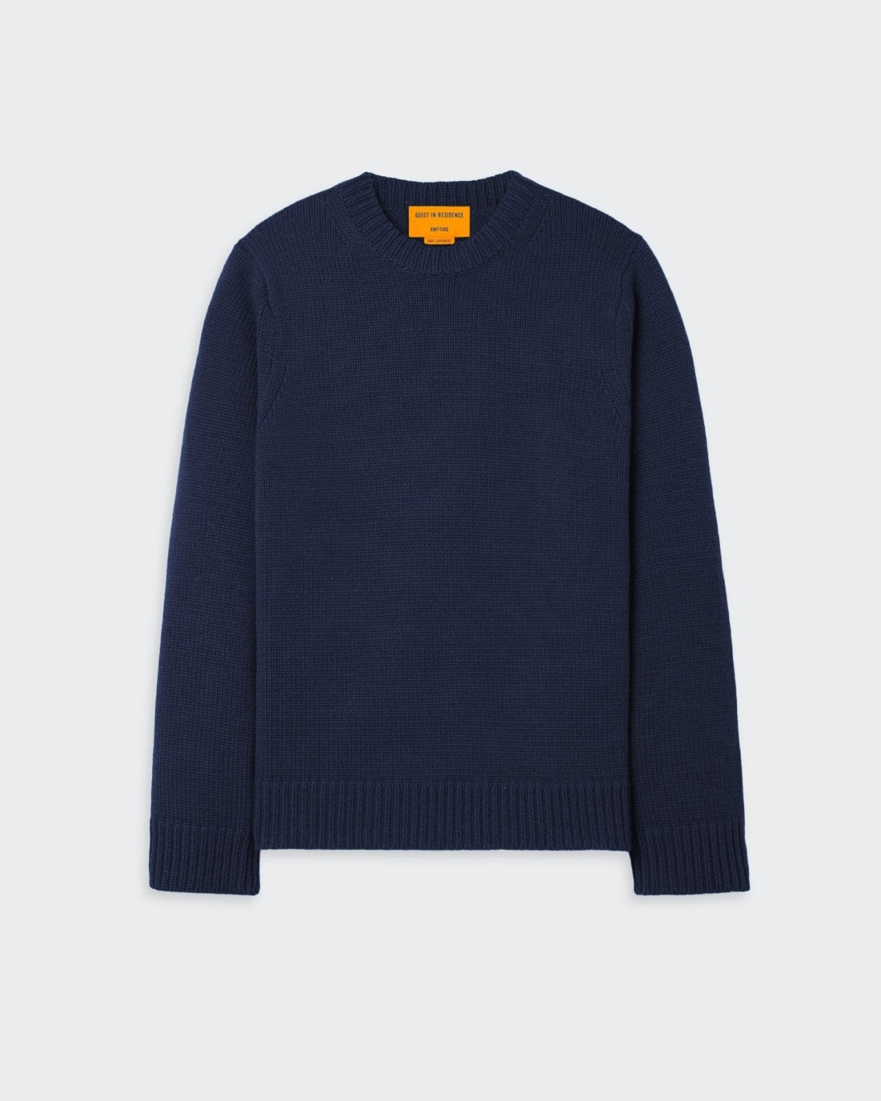 Oversized navy blue cashmere sweater with crew neck and knitted branding.