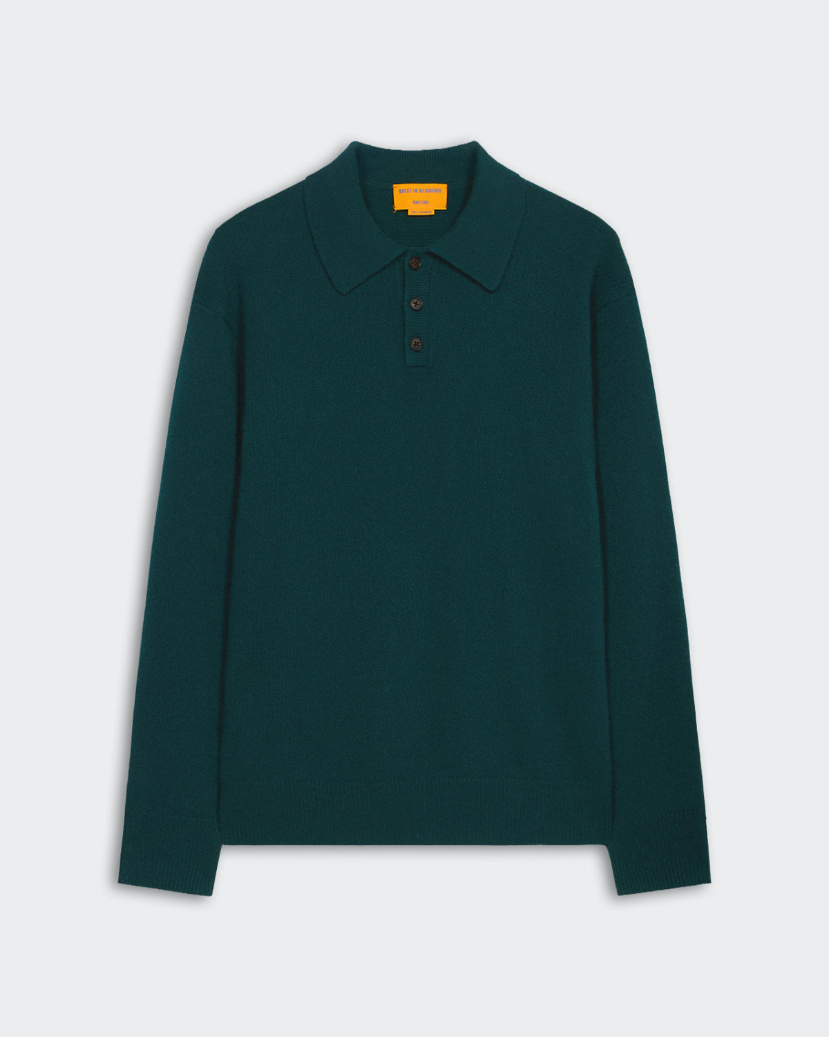 Allday Polo - Holly in deep green cashmere with ribbed collar, cuffs, hem, and three-button placket closure.