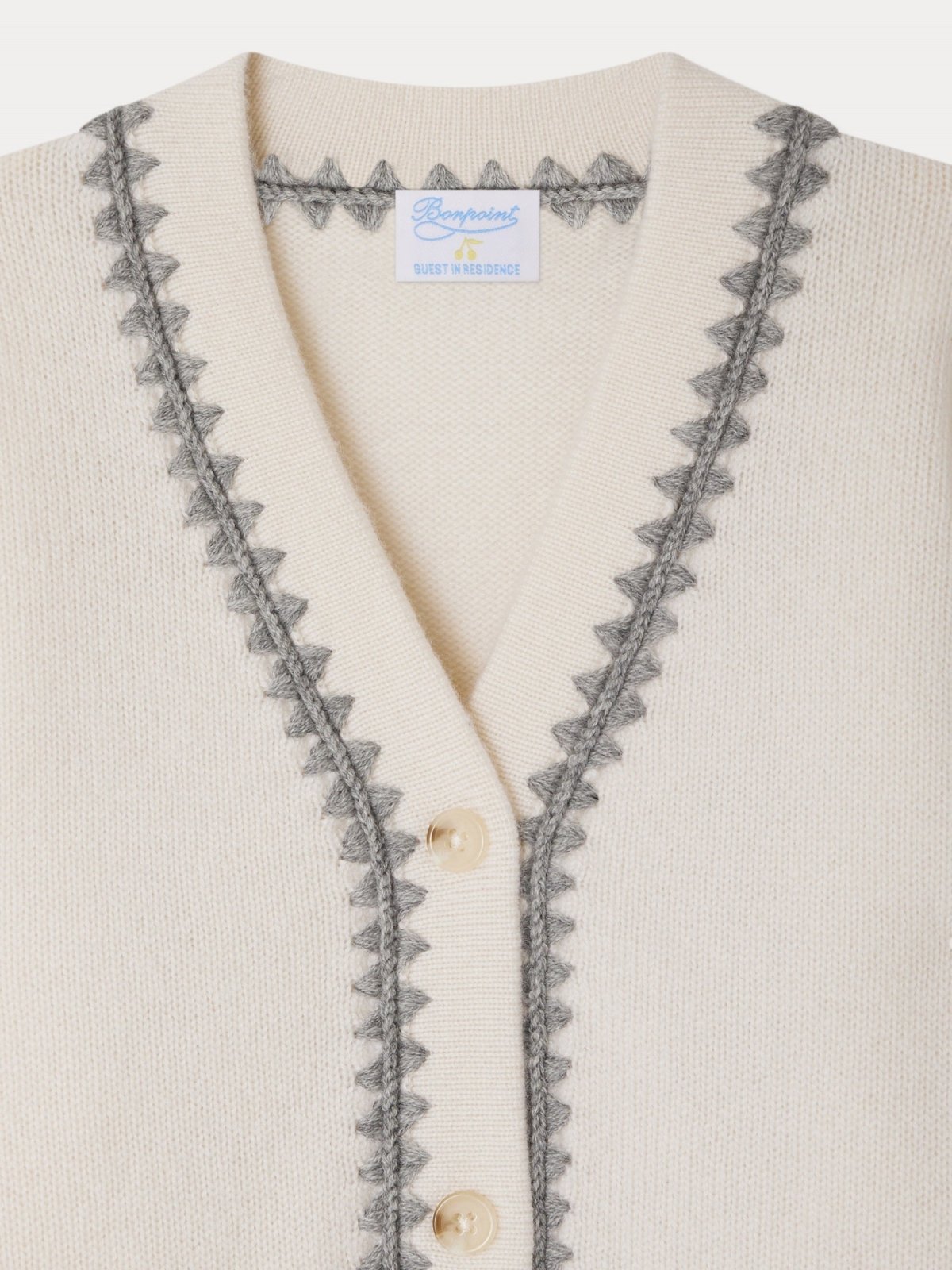 Cream LYNDON cardigan with grey zigzag trim, V-neck, ribbed cuffs, made from 100% certified cashmere ensuring animal welfare