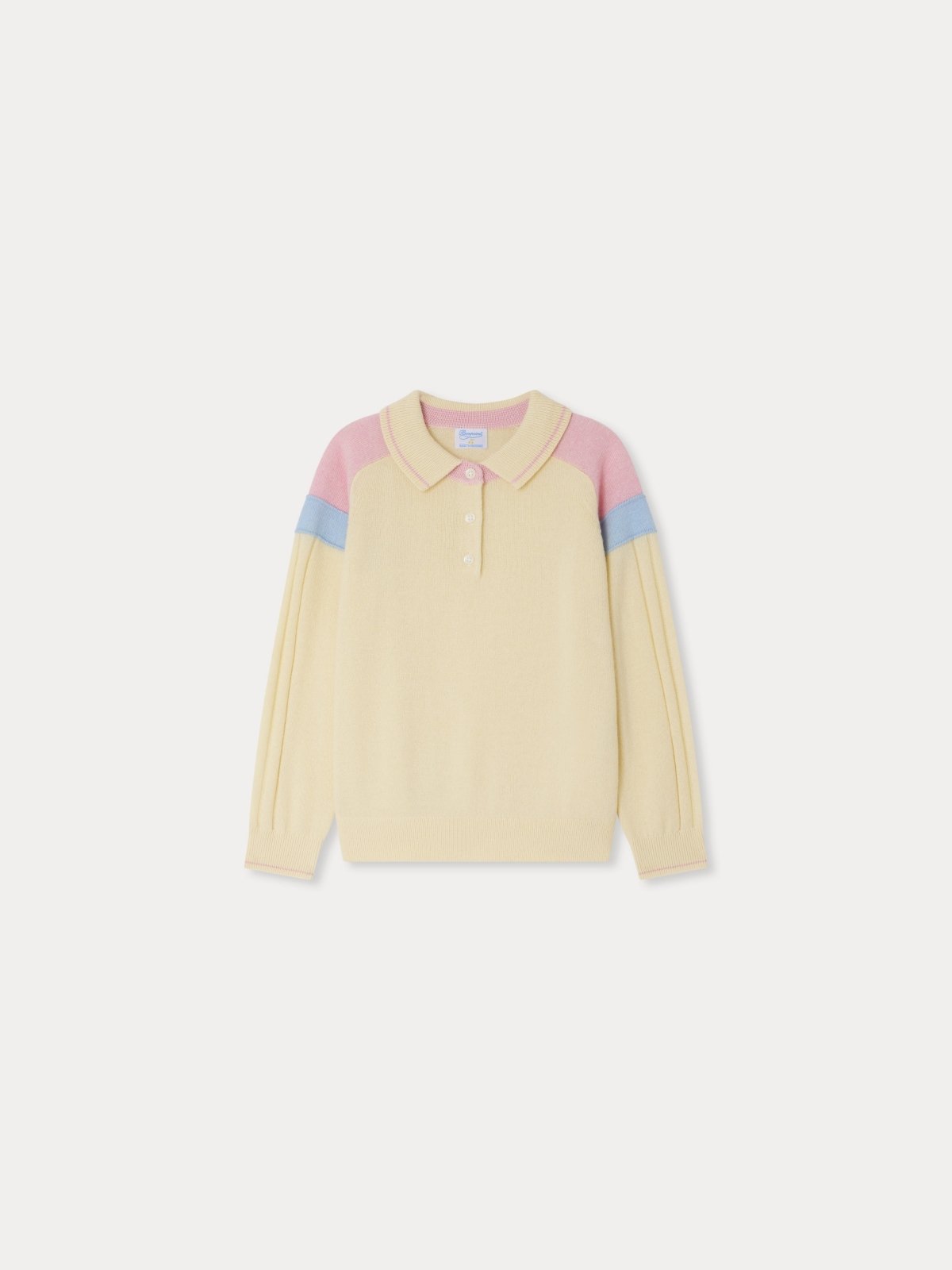 LYNSEY Sweater in soft cream with pink and blue color block shoulders, ribbed collar, cuffs, and hem, 100% cashmere polo style.