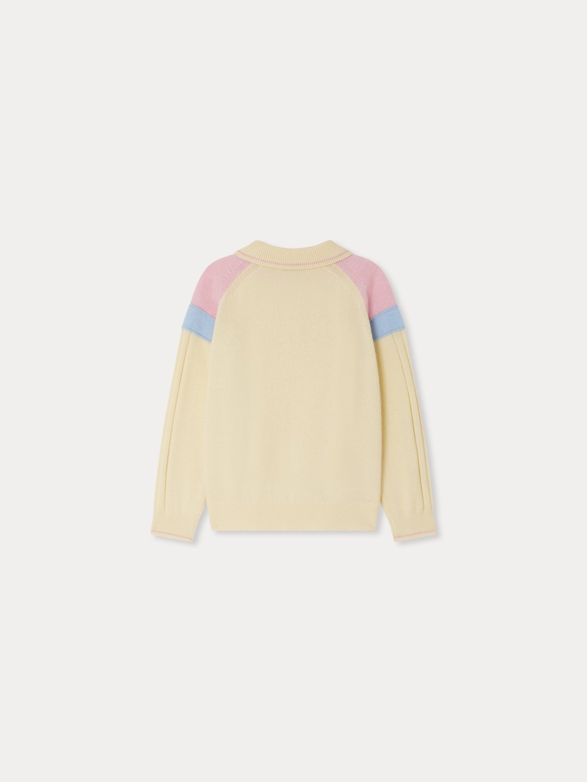 Back view of Lynsey sweater in cream with pink and blue color block on shoulders, ribbed cuffs and hem, cashmere knit design
