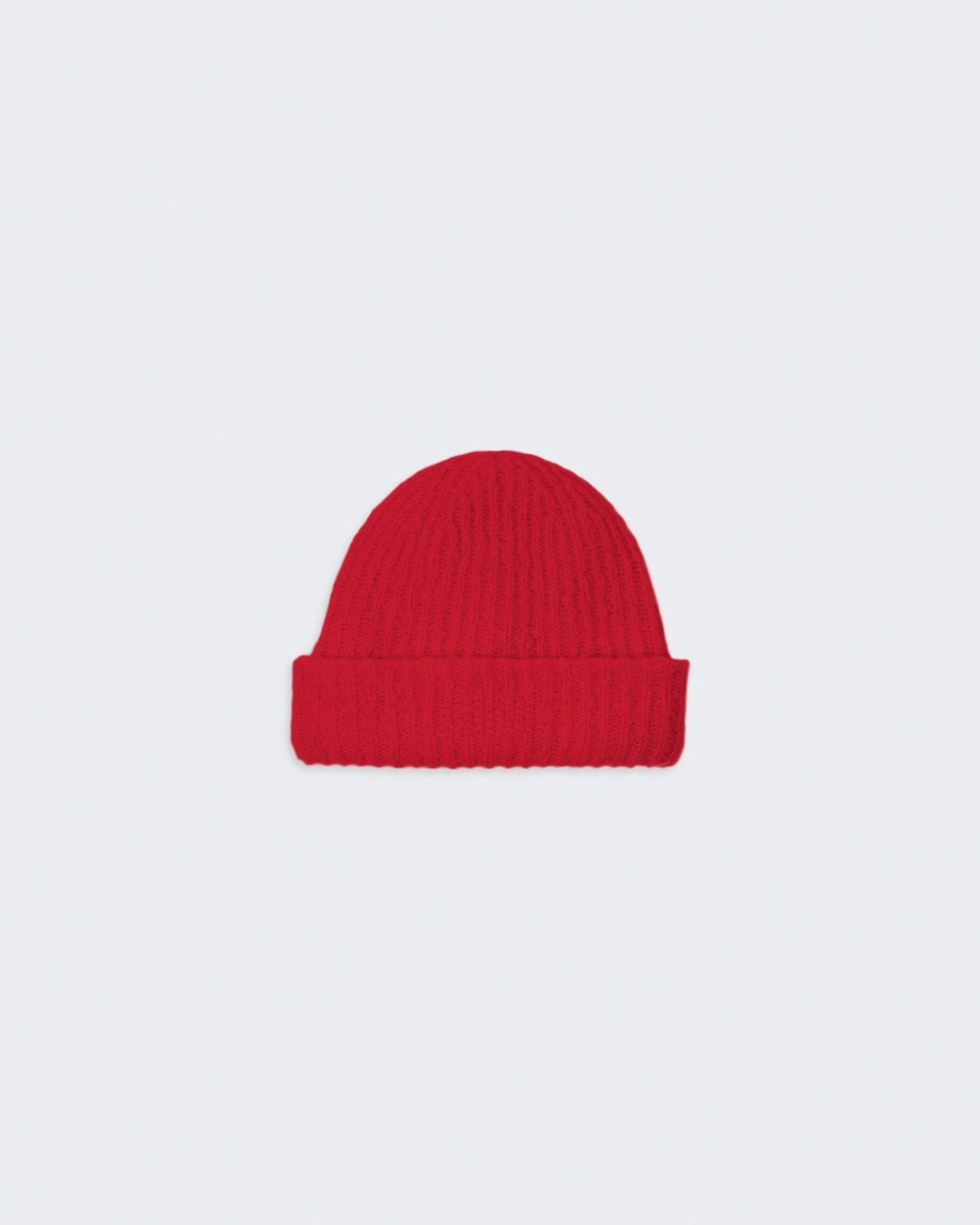 Red knitted beanie with a high cuff hem.