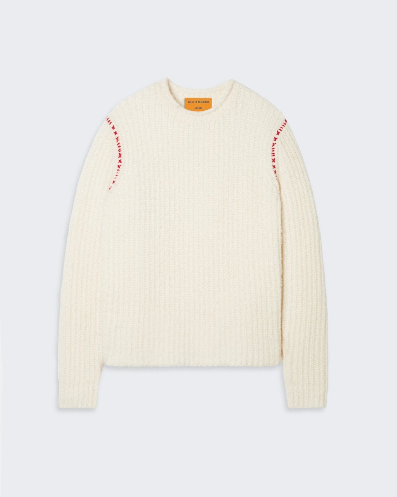 Cream-colored women's crewneck sweater with contrast stitching at the seams.