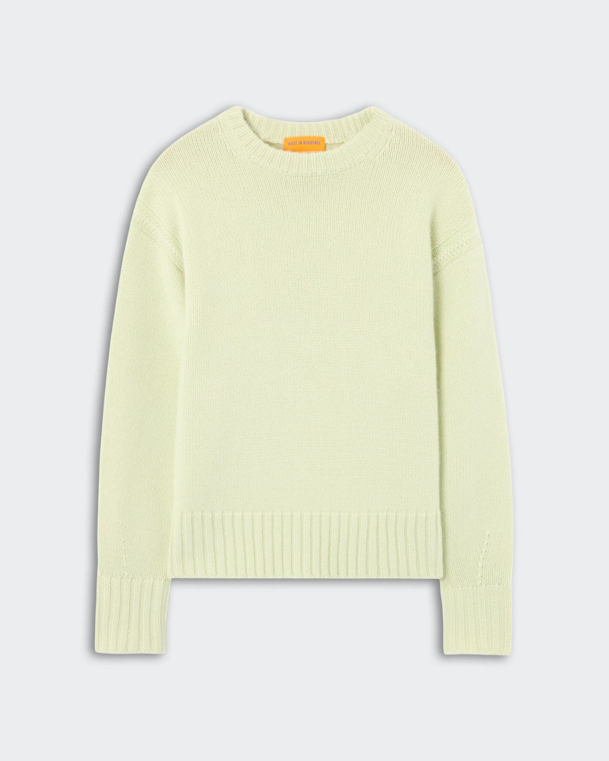 Cozy Crew - Limewash, a soft knit sweater in a pale green shade featuring a classic crew neckline, long sleeves, and ribbed cuffs and hem, laid flat on a neutral background.