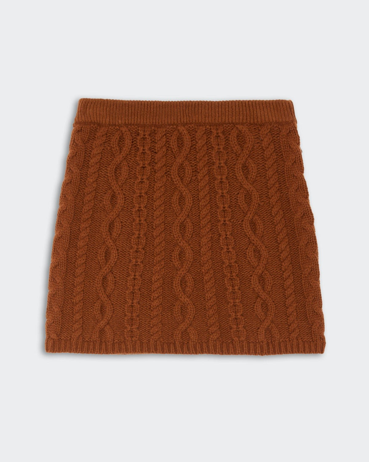 Cable Mini Skirt - Burnt Sienna featuring a textured cable knit pattern in a warm burnt sienna color with a soft ribbed waistband and hem.