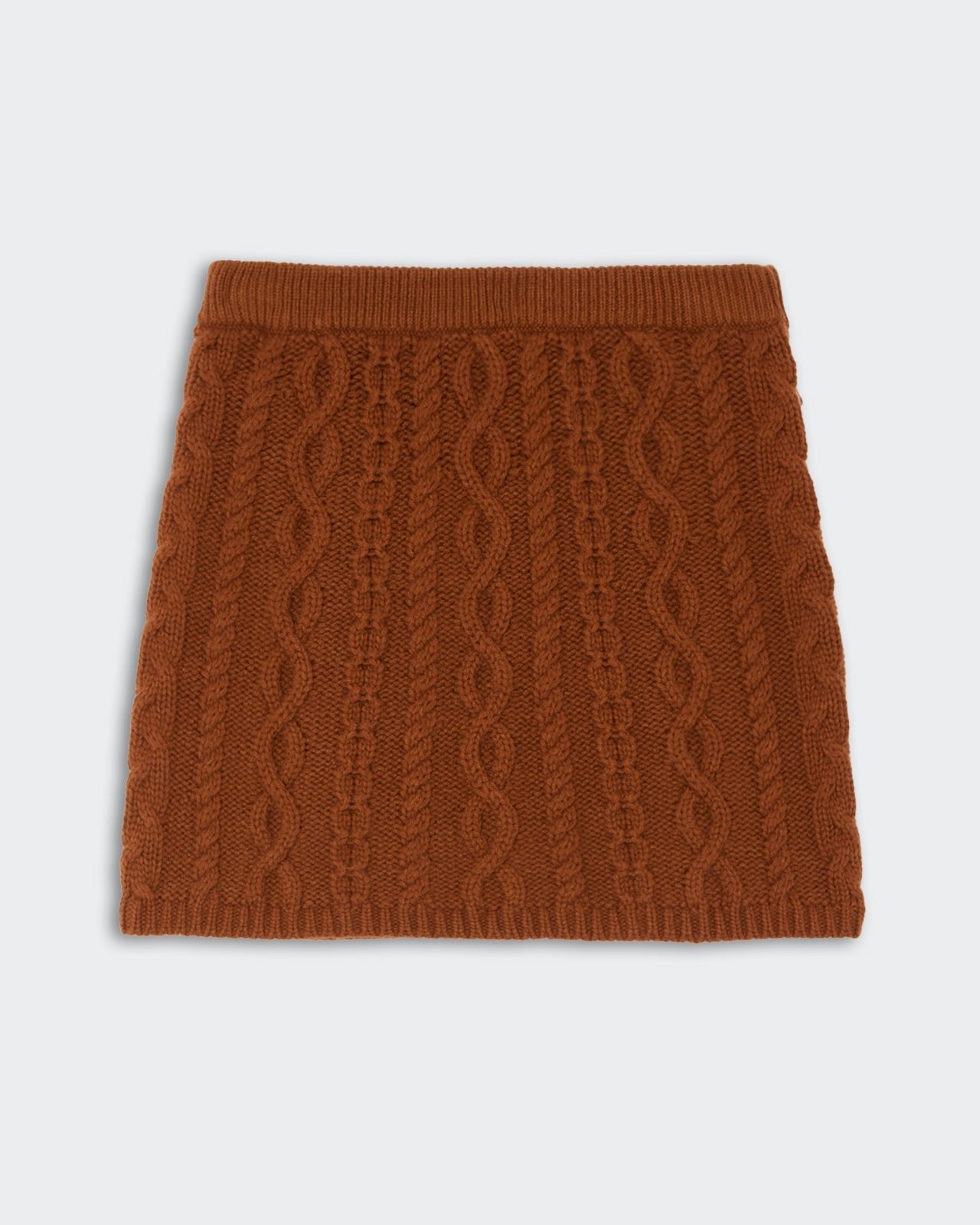 Cable Mini Skirt - Burnt Sienna featuring a textured cable knit pattern in a warm burnt sienna color with a soft ribbed waistband and hem.