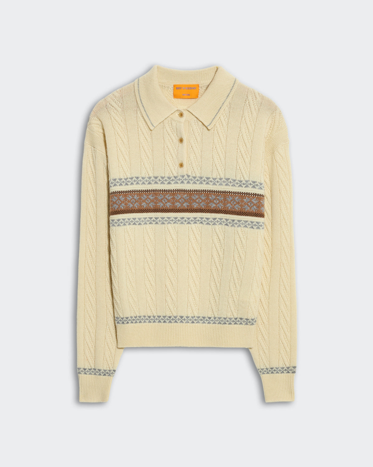 Cream cable knit polo sweater with fairisle snowflake pattern and three-button placket closure